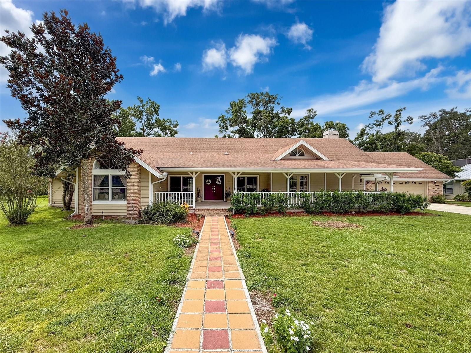 SERENE LUXURY ESTATE LIVING WITH SOUTHERN CHARM conveniently located near historic downtown TARPON SPRINGS, FL. Looking for a place with space? Look no further than this custom-built home with a North Carolina flair. From the porch that extends across the entire front of this amazing home to the redwood deck extending across the entire back complete with an in-ground jacuzzi, you have everything you need to enjoy luxury living at its finest. Situated on 1.34 acres, this home has a lovely wood-burning fireplace in the family room, and a chef’s dream kitchen with ALL NEW CABINETS, GORGEOUS QUARTZ COUNTERTOPS WITH GOLD VEINS RUNNING THROUGHOUT, NEW RANGE HOOD, SINK /FAUCET, and NEW CONVECTION OVEN. The other appliances are within 4 years of age. There is a separate eat-in area with a bay window so one can enjoy looking at nature while having breakfast. The family room, just adjacent to the kitchen, features an inlaid wood ceiling and built-in bookshelves, along with a counter area where one can pull up a stool; have a sandwich; and gaze at the newly remodeled kitchen. There is a large living room with double-door entrance and dining area with vaulted ceilings and skylights. There is also an additional formal dining room surrounded by lovely French doors, which features a pass-through window, two large pantry-type closets and skylights. The formal dining room provides access to the deck where the inviting jacuzzi resides inside a screen enclosure. The primary bedroom features a sitting area and plantation shutters for added privacy. The primary bathroom has a large garden tub, and a separate shower which was renovated in 2023, that includes grab bars for added safety. There are two above counter bowl sinks on top of the vanity, and there is a separate water closet. The large walk-in closet has plenty of space, as well as the large closet on the other side of the primary bedroom, just off the living room. Lots of stuff? It's no problem for this home. There are two bedrooms on the left side of the house, both containing window seats/boxes for additional storage. There is a guest bathroom in this area with granite countertop and above bowl sink. Moreover, there is a tub-shower combo. On the right side of the home, just off the kitchen, there is a fourth bedroom, which can also double as an office. There is an additional bathroom in this area, and it features an above bowl sink over a granite-top vanity and walk-in shower. Unique to this bath is a special octagon accent window. Just off this hallway is the inside laundry room which leads to the spacious garage which features an attic fan and pull-down ladder. The back of the house opens to a patio featuring redwood decking with plenty of room to entertain while taking in the sights and sounds of nature from your private preserve. Frequently deer have been spotted in this area. There is plenty of room in the backyard to add a picnic table, as well as other amenities. Speaking of amenities, Riverside borders Salt Lake, so one can launch their kayak or canoe from the commons area and take in a sunset paddle and not even leave the neighborhood. This community is approximately 2 miles East of historic downtown Tarpon Springs, and not far from Pinellas County's pristine beaches and Tampa Airport. And for those who enjoy biking, the Pinellas Trail is a mere stones-throw away. DON'T MISS OUT ON THIS ONE-OF-A-KIND LUXURY COMMUNITY WITH ACREAGE, NEAR EVERYTHING YOU NEED! THIS PROPERTY IS PRICED TO MOVE!