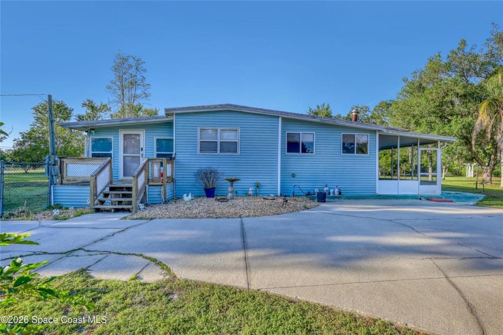 Photo of 2540 Tuscany Drive, Mims, FL 32754 (MLS # O6400644)