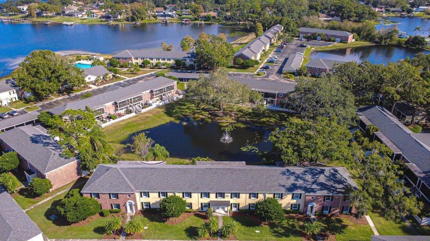 One or more photo(s) has been virtually staged. Nestled in the gated community of Whispering Oaks where residents enjoy direct access to Lake Magdalene’s 252-acre ski lake, you will discover this wonderful 2nd floor 2-bed 1-bath condo overlooking a serene pond. Savor a sip of coffee or wine while sitting on your private screened in balcony or take a stroll and soak up Florida’s beautiful weather. Inside, delight in a light and bright home with an open floor plan, spacious bedrooms, updated bathroom, nice finishes, neutral paint and ceramic tile flooring throughout. The fully equipped kitchen features striking white cabinets, beautiful backsplash, countertops, range, refrigerator, and dishwasher. The dining area is open to the kitchen and family room, and you will appreciate the convenience of a laundry closet with a washer and dryer. There’s plenty of parking and an assigned space in front of the building just for you. Feel reassured that your HOA/maintenance fee includes exterior maintenance, water, sewer, trash, and access to fabulous amenities including clubhouse, community swimming pool that overlooks the lake, 24/7 fitness center, laundry facilities, car wash station, and a private boat ramp for residents. Launch your kayak, fishing boat, jet skis and more. Located in the Carrollwood and Lake Magdalene area off of N. Dale Mabry and Fletcher Ave., you are within a short drive to USF, restaurants, shops, Raymond James Stadium, golf courses, entertainment, hospitals, and easy access to I-275, the Veterans Expressway, Downtown Tampa, Tampa Intl. Airport, the beaches and so much more. Don’t miss out on this great condo at a terrific price! See it Today! *** Eligible homeowners can get up to $35K to help with downpayment or closing cost assistance through the Hometown Heroes Housing Program! (see attach.) ***