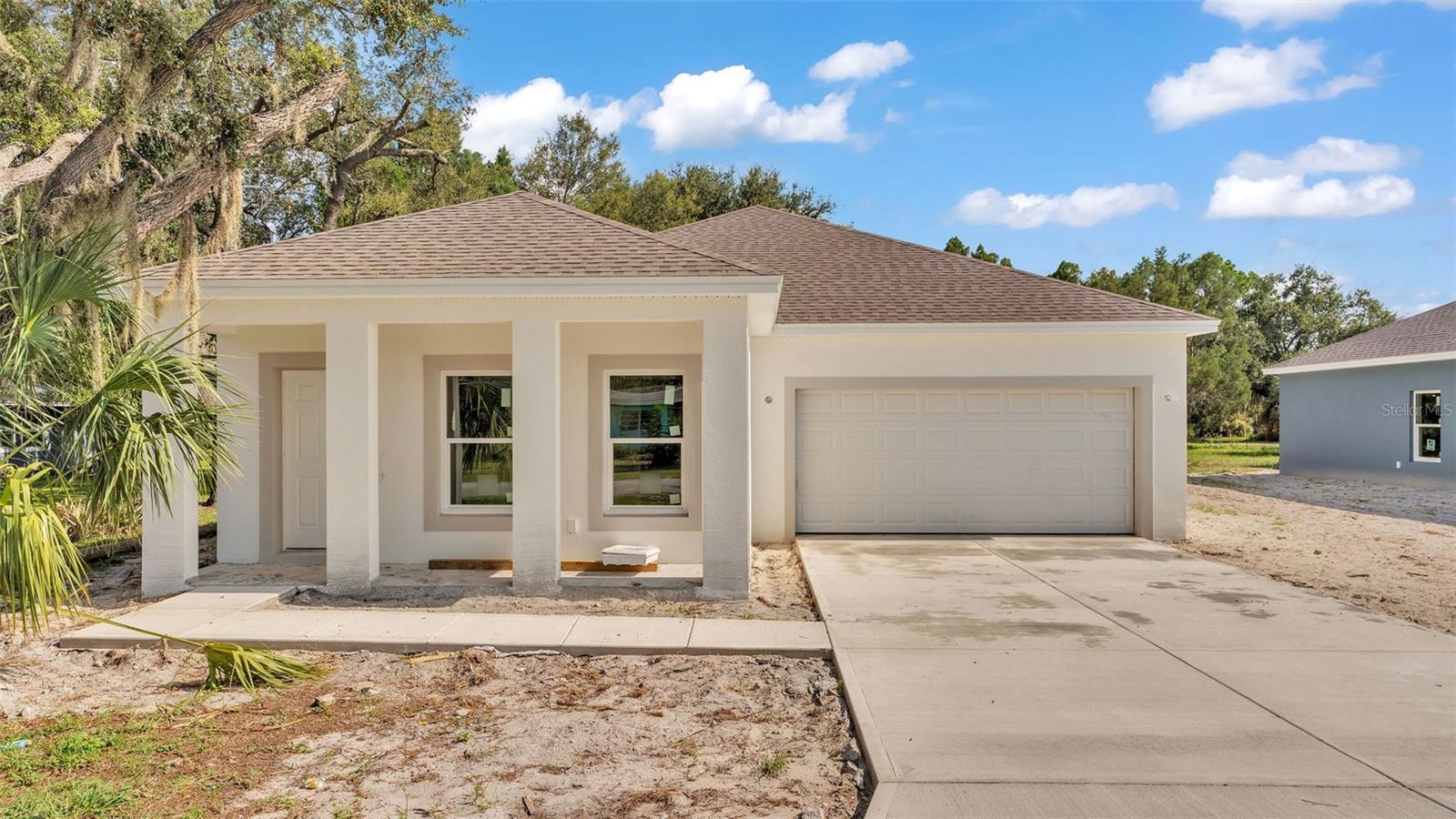 Pre-Construction. To be built. *TO BE COMPLETED IN SEPTEMBER* Discover the perfect blend of modern living and convenience in this brand new 3-bedroom, 2-bathroom home located in the heart of Winter Haven, just minutes from the serene shores of Lake Hartridge. Best of all, there’s NO HOA to worry about! As you step inside, you’ll be greeted by a bright and airy open floor plan that flows seamlessly throughout the home. The luxury vinyl plank flooring adds both elegance and durability, making it a great choice for busy households. The heart of the home is undoubtedly the beautiful kitchen, which features stainless-steel appliances, quartz countertops, and plenty of cabinetry to store all your cooking essentials. The kitchen design allows for easy interaction with guests in the spacious living room, ensuring you never miss a moment while entertaining. Retreat to the primary bedroom, a sanctuary designed for relaxation. This inviting space comes complete with a generous walk-in closet and a luxurious ensuite bathroom, featuring dual sinks and a modern walk-in shower—providing a perfect spot to unwind after a long day. The two additional bedrooms are thoughtfully designed with equal sizing and each boasts a walk-in closet, ideal for family members or guests. The second bathroom, conveniently located near the entrance of the home, includes a shower and tub combination, offering both comfort and functionality. Situated in the heart of WinterHaven, this home places you in close proximity to a variety of retailers, restaurants, and shops, ensuring you have everything you need right at your fingertips. Plus, the adjacent home is also available for sale and currently under construction, offering a unique investment opportunity. Don’t miss your chance to own this exceptional new home in Winter Haven—schedule a tour today and envision the possibilities!