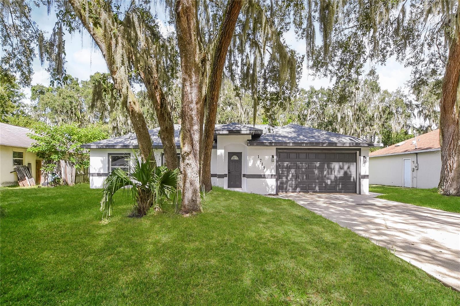 This beautifully updated 3-bedroom, 2-bath home features fresh exterior and interior paint, new LVP flooring, carpet, and refreshed bathrooms. The kitchen boasts resurfaced cabinets, quartz counters, stainless steel appliances including range, microwave, and dishwasher, plus new light fixtures, creating a modern and move-in ready space.
