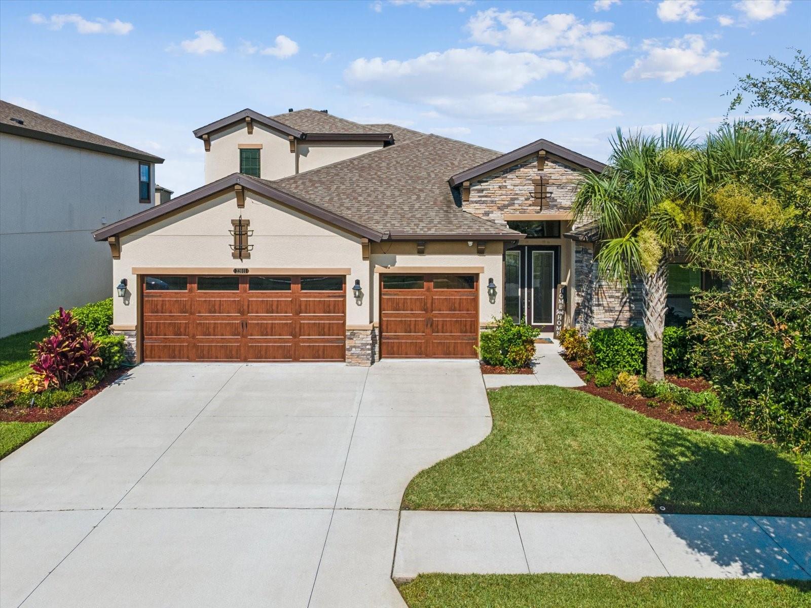 Luxury Living in the Heart of Connerton!
Welcome to this stunning 'Westbay Bayshore II' model home expertly designed for comfort, style, and seamless indoor-outdoor living. This thoughtfully crafted home offers over 3,200 square feet of elegant space, featuring 4 bedrooms, 4 full bathrooms, and a spacious bonus room upstairs for added flexibility.
Step through the stately entryway flanked by decorative columns and into a wide foyer that sets the tone for this exceptional residence. The open-concept layout connects a grand living room with dramatic ceiling beams, a striking stone feature wall, and built-in ceiling surround sound—perfect for entertaining or relaxing. Panoramic sliding glass doors with remote-powered blackout blinds extend your living space to the oversized covered lanai, creating a true indoor-outdoor experience.
The chef-inspired kitchen is a dream, featuring GE Café Bluetooth-enabled appliances, a wine fridge, and an expansive island that flows into the casual dining area. The outdoor kitchen elevates your hosting capabilities with a built-in natural gas grill, ice machine, fridge, sink, decorative lighting, and even Nebula outdoor landscape lighting surrounding the entire home.
Retreat to the luxurious owner’s suite with dual walk-in closets, a spa-like bath, and private pool access. Downstairs bedrooms and office showcase custom details such as shiplap, chair rail, murals, and decorative moulding. The home also features upgraded 6" baseboards throughout, adding a refined touch to every room.
Enjoy Florida living year-round in your private backyard oasis featuring artificial turf, an in-ground heated pool with waterfall and sun shelf, and a child safety enclosure for peace of mind.?
Additional upgrades include:
UV lights on both Carrier A/C units
Ecobee Bluetooth thermostat
RainBird Bluetooth irrigation system
Whole-house DuroMax portable generator
Upgraded sauna in garage
Built-in overhead and wall-mounted garage storage
Epoxy garage flooring
This is more than just a home—it’s a lifestyle. Located in the highly desirable Connerton community, known for its top-rated schools, resort-style amenities, and nature trails.
Don’t miss your chance to own this one-of-a-kind home. Schedule your private tour today!