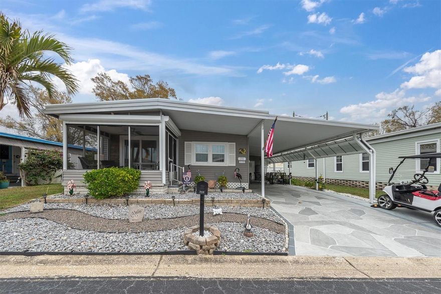 Come see this beautifully updated 2-bedroom, 2-bath manufactured home, thoughtfully remodeled over the past several years. The property features a dining area with built-in cabinets, a walk-in kitchen pantry, a remodeled bathroom in the large primary bedroom, and a spacious walk-in closet. The second bedroom is located across the hall from the second remodeled bathroom. The carport may accommodate 2 cars in tandem and includes a designated space for a golf cart. The charming covered patio includes a small fenced area, perfect for relaxing or entertaining while giving your small pets room to roam. Oversized storage is an extension of the home and is currently used as a workshop and laundry area. The front of the home has a raised, enclosed, and screened patio area perfect for enjoying your coffee or reading a book. 
Inside, you’ll find 1,056 square feet of living space with luxury vinyl flooring throughout, creating a modern and low-maintenance interior.
Recent updates include:

New Roof (2016)

New Windows and Doors (2016)

Kitchen Appliances and Granite Countertops (2015)

Both Bathrooms Remodeled (2018)

New HVAC system (2023)

New Water Heater (2015)

The home sits on a 50 × 80 lot you own, in a welcoming 55+ community that offers an active lifestyle. Residents enjoy community events and great amenities, including a clubhouse, swimming pool, shuffleboard courts, a covered picnic area with a grill, and a fishing pier overlooking a large open lake.

This home has been lovingly maintained and well cared for, making it truly move-in ready. Schedule your showing today—this one won’t last long!