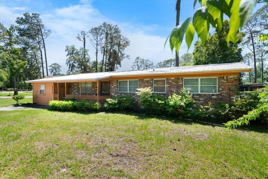 Welcome to this beautifully maintained 3-bedroom, 2-bathroom brick home offering both comfort and convenience. The durable metal roof was replaced in 2016, while the AC units and furnace were newly updated in 2025. A gas water heater, just six months old, adds to the home's energy efficiency. The kitchen features a brand-new electric stove and sink, perfect for home chefs. Enjoy easy maintenance with no carpet throughout the home. The primary bathroom includes a recently upgraded walk-in shower (approximately one year old), offering a touch of luxury. A versatile flex room provides the perfect space for a home office, gym, or creative studio. Start your mornings or unwind in the evenings on the spacious enclosed porch — a cozy retreat all year round. This home makes commuting a breeze.