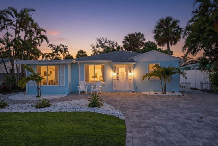 Just minutes from the world-famous white sands of St. Pete Beach, this impeccably maintained and fully furnished 3-bedroom, 2-bathroom sanctuary captures the essence of coastal living with modern sophistication and carefree comfort. Step inside and be greeted by a home bathed in natural light, where thoughtfully curated design and premium updates set the tone for daily life and stylish entertaining. Long wide luxury vinyl planks flow seamlessly throughout the home to effortlessly connect the entire space. The heart of the home is a magazine-worthy kitchen, featuring quartz countertops, sleek stainless appliances, floating shelves, chic modern herringbone backsplash, and LED lighting that highlights every detail with a fresh, contemporary glow. The home’s spa-inspired primary bathroom is a soothing escape—complete with a garden tub, European-inspired floating vanity, and stylish reeded tile—inviting you to begin and end each day in serenity. Every practical comfort has been considered, with a newer roof, impact-resistant windows, new HVAC, and a new water heater ensuring peace of mind and year-round ease. Outside, your private backyard retreat unfolds like a dream. A covered lanai, complete with a ping pong table and tiki bar, beckons weekend gatherings and sunset laughter. Beyond, a lush landscape features a putting green and fire pit, spaces designed for both play and peaceful relaxation. Whether it’s morning coffee in the sunshine or lingering evenings under starlight, this yard is where memories are made. Thoughtful touches and upgrades throughout make this home move-in ready from day one, and the fully furnished design means you can start living the beach lifestyle immediately. And location couldn’t be more inviting: just steps to St. Pete Beach’s glittering shoreline, vibrant restaurants, boutique shopping, and lively entertainment—yet set in a peaceful neighborhood that feels like a true retreat. This is more than a home—it’s your everyday escape to the Gulf Coast, where sunlit rooms, thoughtful design, and backyard evenings become the backdrop to a life well lived. Start living the Florida Beach Life today!