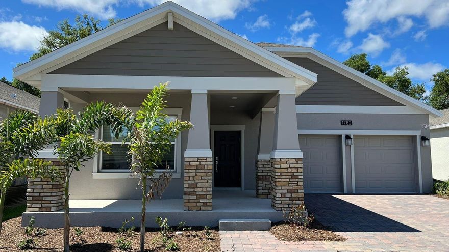 Move In Ready in December 20205! Newer home no Neighboors in the back only conservation area to enjoy and admire. 3 min walk in distant to the Tohoqua subdivision amenities and  less than 2 miles from the Turnpike. Make an appointment to see it and be ready to fall in love! Make this recently built 2022 spacious 3 bedrooms plus office/den with 2 bathrooms, more than 2,000 Sq Ft SMART and High Efficient home.This home is perfect for family and entertaining as the spacious great room flows easily onto the extended covered porch through the sliding glass door. This patio is ideal for creating your own backyard oasis with comfy outdoor furniture or enjoying a BBQ with friends. WASHER AND DRYER INCLUDED. Check the pictures of the outside to see you will have no neighbors at the back which offers the perfect space for privacy and relaxation. You will love to have a spacious modern kitchen, 42 inch upgraded cabinets, upgraded stainless-steel Whirlpool appliances, and an enlarged island ideal for a breakfast. The master bedroom connected to an ample bathroom with dual-sink vanity and walk-in closet, and two secondary bedrooms, plus office/den and a full bath. This gorgeous 1-story home features 9-ft. floor ceilings, upgraded luxury tile flooring in the living and wet areas, and carpet in the bedrooms. Quartz top in bathrooms and kitchen tops. You will love to have a modern ceiling fan w/control remote in the living/social area. The house is energy efficient with low-e double pane windows and sliding glass doors, and Energy Star Whirlpool appliances both of which will save you money on your monthly energy bills. Tohoqua community has been built with families in mind and it is conveniently located a block away from walking trails, community amenities such as Clubhouse, Swimming Pool, Tot Lot, Tennis Court, Playground, Fitness Center, BBQ with Gazebo, tables+chairs area and playground. Near Disney, major attractions, outlet malls, supermarkets, a large development filled with Shopping, Restaurants and Entertainment. The Remington Golf Club is just down the road.