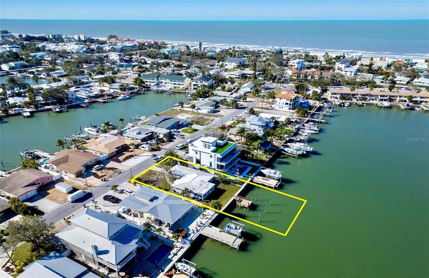 An exceptional Intracoastal waterfront offering with 60 feet of deep, protected water frontage, a newer seawall with dock pilings suitable for a 15’ beam and 42’ vessel. This 60’ x 115’ lot presents the opportunity to create a custom coastal residence in one of Pinellas County’s most desirable beach communities. A newly constructed, multi-million-dollar contemporary home next door highlights the area’s strong value and luxury trajectory. Bring your vision and secure your place on the Intracoastal Waterway in one of Florida’s most sought-after beach communities…….. The existing block ranch home with terrazzo flooring sustained substantial flood damage during Hurricane Helene (17” of water) and is being sold as-is at land value, making this an ideal canvas for a new luxury build........  The property includes a 120’ irrigation well, eliminating the need for city water for landscaping. NOTE: Please do not walk on dock. Railing/planks need repair.  Interior appliances do not function though A/C has been on …….. Located just steps from the sugar-sand beaches and calm turquoise waters of IndianRocks Beach, this homesite delivers the quintessential Florida lifestyle—boating, paddleboarding, fishing, jet skiing, and breathtaking sunsets from your own backyard…….. IndianRocks Beach is cherished for its small-town charm and vibrant coastal community, offering seven parks, tennis and pickleball courts, a community boat ramp, art center, history museum, local restaurants, and year-round events—all within a golf-cart-friendly setting. Walk to dining and a beloved French bakery, or enjoy signature local events including Oktoberfest, the Holiday Boat Parade, Holiday Street Parade, and A Taste of IRB…….. Conveniently located just 30–40 minutes from Tampa International Airport and downtown St. Petersburg’s arts, culture, and dining scene, with top medical facilities only 15 minutes away, this location offers both ease and escape…….. For investors, IndianRocks Beach allows short-term rentals with no minimum duration, providing exceptional flexibility and income potential…….. Please schedule a private showing to take in the beautiful water views and experience firsthand the charm, community, and coastal lifestyle that make IndianRocks Beach truly special.