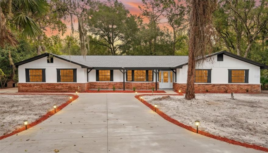 Welcome to this beautifully updated 3-bedroom, 3-bath home on 1.42 acres in the sought-after community of A Quiet Place in the Country. This spacious single-family property offers the perfect blend of modern upgrades, peaceful privacy, and top-rated Port Orange schools. Step inside to find new flooring throughout, a fully updated kitchen and beautifully renovated bathrooms, and a bright, open layout designed for comfortable everyday living. Enjoy peace of mind with major improvements including a new roof, new AC, and a new water heater—all providing long-term efficiency and reliability. Outdoor living is a dream with a brand-new deck overlooking the expansive 1.42-acre lot and all-new landscaping that enhances the home's curb appeal and serene country setting.

Located in one of the area's most desirable neighborhoods, this home offers the rare combination of acreage, privacy, and conveniencejust minutes from shopping, dining, beaches, and major roadways. Don't miss your chance to own a fully updated home in a prime Port Orange school districtmove-in ready and built to impress!