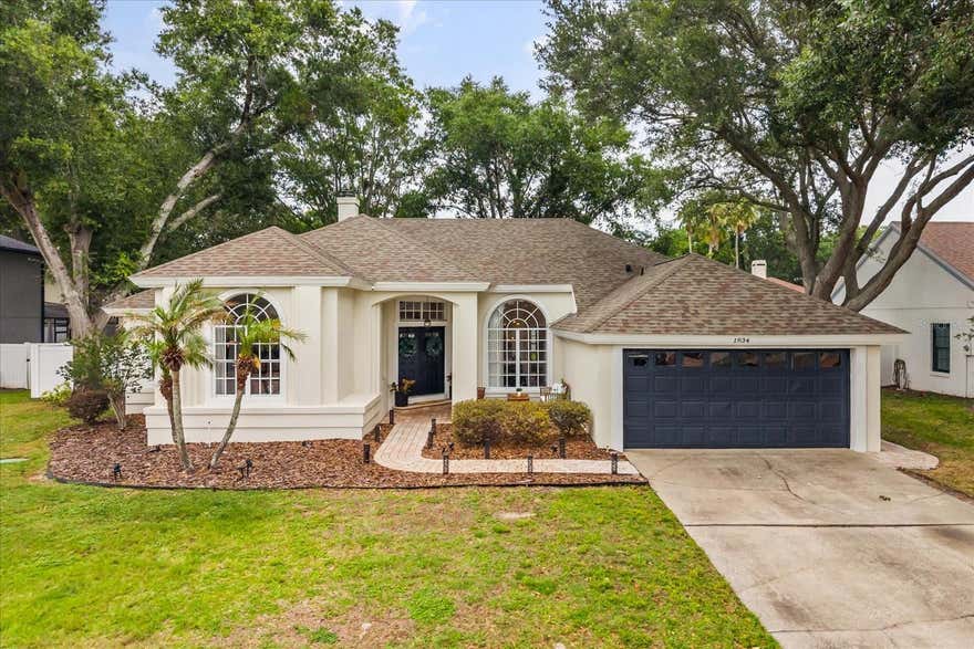 You’ll feel right at home the moment you step into this beautifully maintained one-story home in Gotha, FL, tucked away on a quiet CUL-DE-SAC in the highly desirable Saddlebrook community. Offering 4 bedrooms and 3 full baths, this residence effortlessly combines comfort, functionality, and timeless style... NO FRONT NEIGHBORS and a peaceful GREEN SPACE VIEW adding to the privacy and charm.

From the moment you enter, you're welcomed by a grand foyer with soaring ceilings, rich wood flooring, and elegant architectural details. A formal dining room sits to the right, while a formal living space is positioned to the left—ideal for entertaining or flexible everyday living. At the front of the home, a private office or fourth bedroom with an attached full bath provides the perfect setup for guests or remote work.

Designed as a true split floor-plan, the layout offers optimal privacy with the primary suite thoughtfully separated from the secondary bedrooms. The well-appointed kitchen is designed for both everyday living and entertaining, featuring a spacious eat-in area, breakfast bar, and seamless flow into the expansive family room. The main living area is filled with natural light, highlighted by TRANSOM WINDOWS and FRENCH DOORS that open to the lanai, creating an airy indoor-outdoor feel. Here, you'll also find a cozy WOOD-BURNING FIREPLACE framed by CUSTOM BUILT-INS, creating a warm and inviting focal point.
The primary suite is privately situated and offers a relaxing retreat with a large walk-in closet, dual vanities, soaking tub, and walk-in shower. Two additional bedrooms and a full bath provide ample space for family or guests.

Step outside to enjoy true Florida living. The home opens to an expansive brick-paver lanai, perfect for gatherings, overlooking a backyard complete with a BUILT-IN PLAYGROUND, a rare and fun feature for families.

This home is MOVE-IN READY with recent updates including a NEW AC (2026), interior paint (2023)...

Conveniently located just minutes from shopping, dining, major highways, Orlando attractions, POPULAR THEME - PARKS and area airports, Saddlebrook offers both tranquility and accessibility.

Schedule your private showing today, this one checks all the boxes.