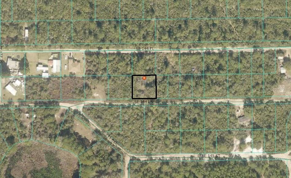 .23-acre lot zoned R4 with well and Septic, ideal for residential, multi-use development, or mobile home. Sister property is also available for expanded potential.