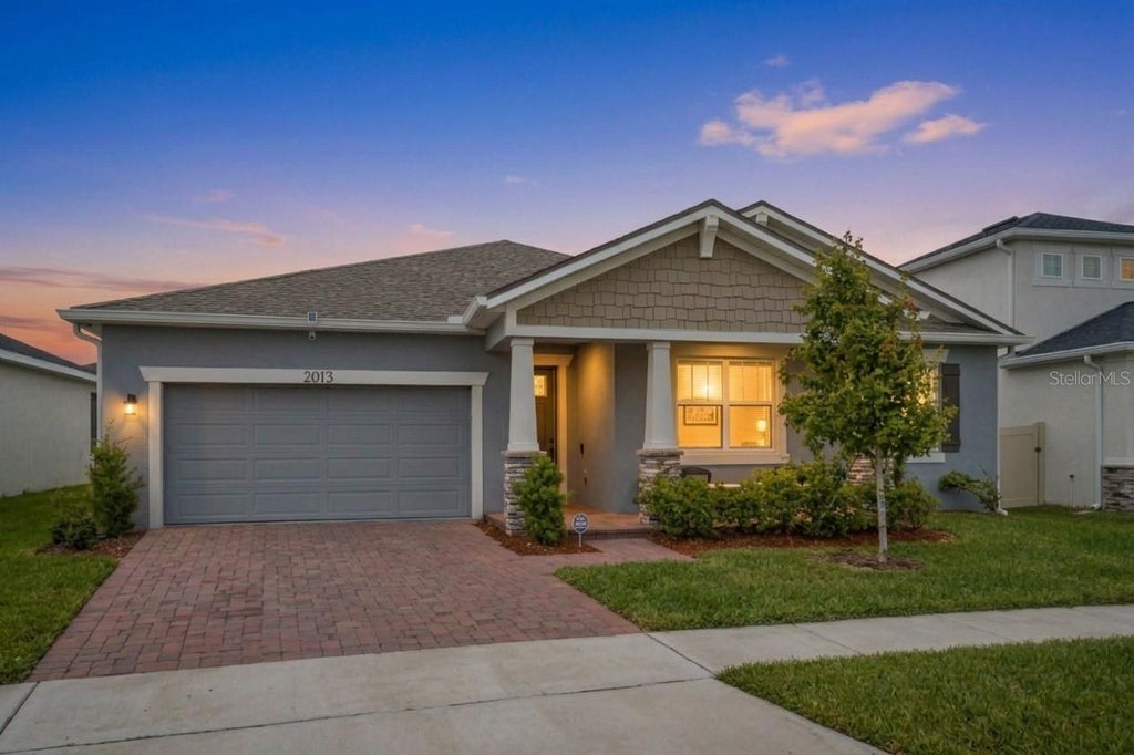 Photo of 2013 Valencia Blossom Street, Clermont, FL 34711 (MLS # O6452203)