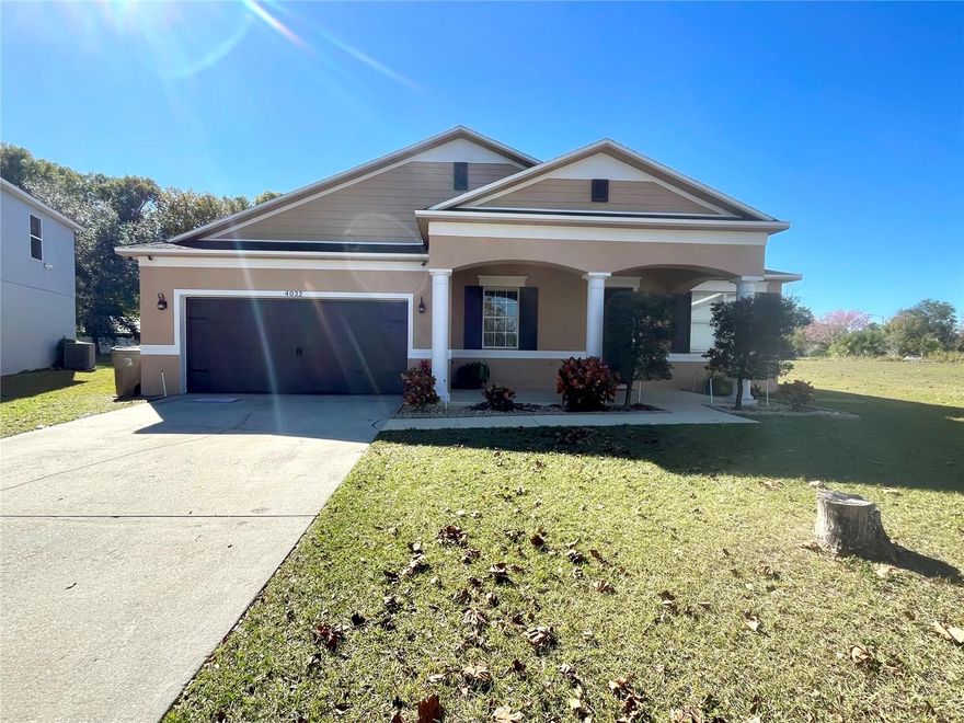 Welcome home to this bright and spacious 4-bedroom, 2-bath residence with a 2-car garage, tucked inside Audubon Reserve and conveniently close to the Bellalago area. Set on over one-third of an acre and backing up to a conservation area, this home offers the kind of privacy that’s hard to find—no neighbors behind you, just peaceful views and extra breathing room.

Step through the front door into a welcoming layout with a separate living room and dining room, perfect for hosting or simply enjoying a little extra space to spread out. Continue into the heart of the home: an open family room and gourmet kitchen designed for everyday comfort and easy entertaining. You’ll love the exotic granite countertops, stainless steel appliances, 42-inch solid wood cabinets, and the oversized granite island with plenty of room for meal prep, snacks, and gathering. There’s also a separate eat-in kitchen area, plus upgraded features including two built-in ovens, a cooktop, and a microwave.

Throughout the home, you’ll find neutral gray tile flooring—no carpet anywhere, giving the space a clean, modern feel and making upkeep a breeze. With nearly 3,000 sq. ft. total area, including the garage and covered front porch, this home offers comfort, space, and a relaxing setting you’ll look forward to coming back to every day. Act now! This one won't last long! All applicants are required to do a credit and background check. Renters insurance is required.   Max 2 pets.  No puppies, kittens, large, or aggressive breeds. Accepted on a case by case basis.   Lawn care included with rent!
