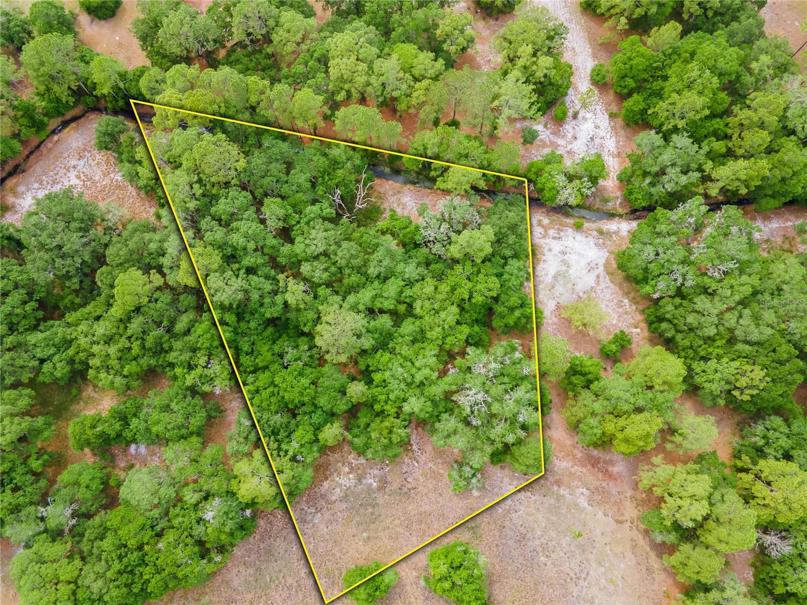 Experience the best of both worlds with your own slice of Country Paradise in this deed restricted equestrian community of Sundance that also offers a boat ramp entering the Little Manatee River, two docks from which you can relax and fish, covered pavilion, restroom facilities and a playground. Stables for rent, two barns with 40 stalls, a round pen and a practice arena. What a great place to settle your roots and raise a family! Enjoy Florida living at it finest! Private secluded 1.63 acres waiting for you to build your dream home on. (The adjoining 1.54 acre parcel is also available)