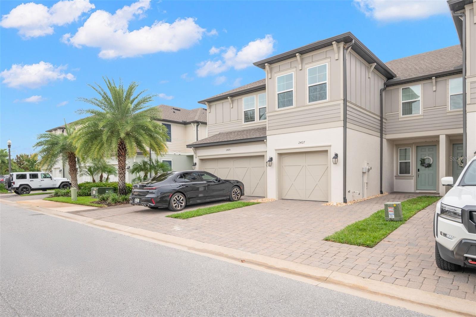Welcome home to this 3 bed/2.5 bath townhome in the highly sought-after Towns at Belleair Grove community! From the moment you step inside, you’ll love the bright, open-concept floor plan with high volume ceilings that is designed for both everyday living and entertaining. The spacious living and dining area features wood-look tile flooring and flows seamlessly into the modern kitchen with quartz countertops, light gray cabinetry, decorative tile backsplash, stainless steel appliances, and breakfast bar. Your sliding glass doors take you to your screened in porch, which overlooks conservation and is nice and private. A convenient half bath, ample storage (including a large under-stair closet), and direct garage access complete the first floor. Upstairs, the primary suite offers peaceful conservation views, high ceilings, recessed lighting, large walk-in closet, and a spa-like en suite with oversized step-in shower, dual-sink vanity, linen closet, and private water closet. Two additional bedrooms with generous closets share a full hall bath with tub/shower combo. The laundry room with extra storage, laminate wood flooring in the hallway and stairs add convenience, while the bedrooms are carpeted for comfort. Enjoy all that Towns at Belleair Grove has to offer, including a resort-style pool and spa, clubhouse, and private mailboxes—all within a secure gated setting. Ideally located near US-19, this home offers easy access to Tampa, St. Pete, beaches, dining, and shopping. With its modern finishes, smart layout, and unbeatable location, this townhome is the perfect blend of comfort and convenience. Don’t wait—schedule your private tour today!