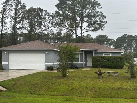 Photo of 24 Seven Wonders Trail, Palm Coast, FL 32164 (MLS # FC318474)