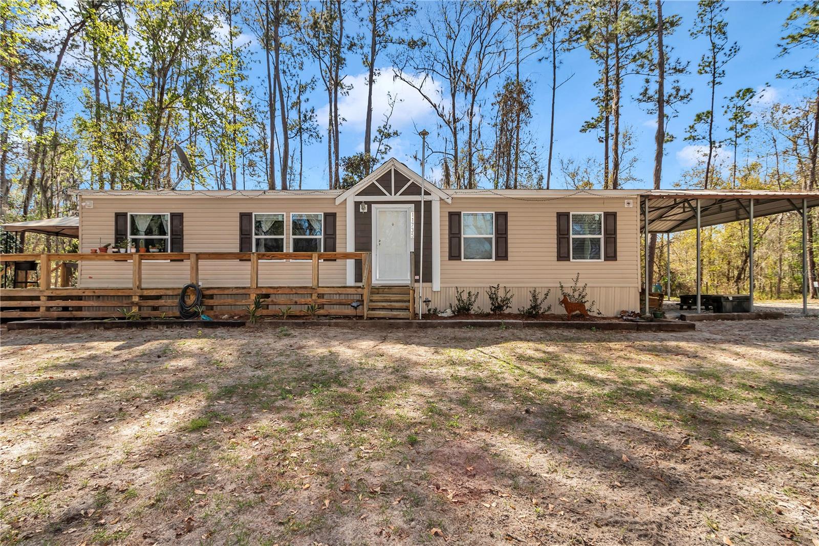 Price has been Reduced! Seller Motivated! Discover rustic farmhouse charm and serene lakefront living with this beautiful 3-bedroom, 2-bathroom home in Hawthorne, Florida. This home is situated on 2.27 fully fenced, tree-filled acres with a private automatic gate, this 1,456 sq ft property offers the perfect combination of privacy, space, and natural beauty. Surrounded by mature trees that provide shade and a peaceful backdrop, this home invites you to enjoy the quiet simplicity of country life—without sacrificing convenience. Located on Lake Jeffords, you'll have direct water access with your own private dock, perfect for fishing, kayaking, and enjoying lake views year-round. An expansive back and side deck creates a great space for grilling and entertaining, while the property also includes a carport and a large shed for all your storage needs. Inside, the home features rustic farmhouse charm throughout and comes semi-furnished with essential appliances already in place—including a washer, dryer, 2024 refrigerator, 2024 range, microwave, and dishwasher. The layout is comfortable and functional, offering cozy living spaces that overlook the peaceful, wooded surroundings. Just 30 minutes from Gainesville and Ocala and about an hour from Jacksonville and Daytona Beach, this home is ideally located for those who want tranquility with easy access to city amenities. This property is an incredible opportunity to own a slice of Florida Lakefront Paradise.