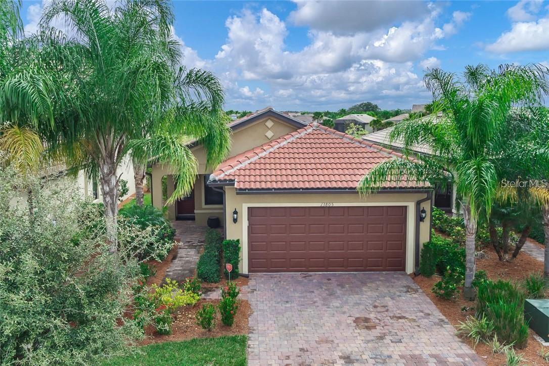 Experience the pinnacle of lakefront living in the heart of IslandWalk, one of Venice’s most vibrant and luxurious gated communities. This meticulously maintained 2-bedroom, 2-bathroom home with a den offers 1,437 square feet of elegant design and thoughtful upgrades. With no carpet throughout, the interior features ceramic tile in the main living spaces and waterproof laminate flooring in the bedrooms and den, blending style with practicality. The open-concept kitchen is a showpiece, boasting upgraded premium Landen maple cabinets adorned with crown molding, granite countertops with bullnose edging, and an island with additional seating, perfect for entertaining. Flowing seamlessly into the great room and dining area, the kitchen also opens directly to the screened-in lanai, where serene lake views provide a peaceful escape. The primary suite is a private retreat with a custom walk-in closet and a luxurious en-suite bath complete with dual sinks and a walk-in shower. The versatile den easily serves as a third bedroom or a dedicated office. Every detail of this home has been crafted for comfort, beauty, and ease of living.
IslandWalk offers an unmatched resort lifestyle with two expansive clubhouses, an event center, two resort-style pools, a lap pool, 12 pickleball courts, eight Har-Tru tennis courts, a dog park, playground, basketball court, community garden, and miles of picturesque walking, biking, and golf cart trails weaving through Venetian bridges and tranquil waterways. A full-time activities director curates a vibrant calendar of events, clubs, and social gatherings. Just a bike ride away is the Atlanta Braves stadium and the brand-new marketplace featuring Publix, restaurants, shopping, and everyday conveniences. Downtown Wellen Park offers waterfront dining, rooftop bars, boutique shopping, an 80-acre lake, splash pad, playground, public gathering spaces, live music, and theater, with a hammock grove and permanent food truck park on the horizon. HOA fees include lawn care, cable, WiFi, full access to amenities, and 24-hour gated security. This is more than a home—it’s a lifestyle.