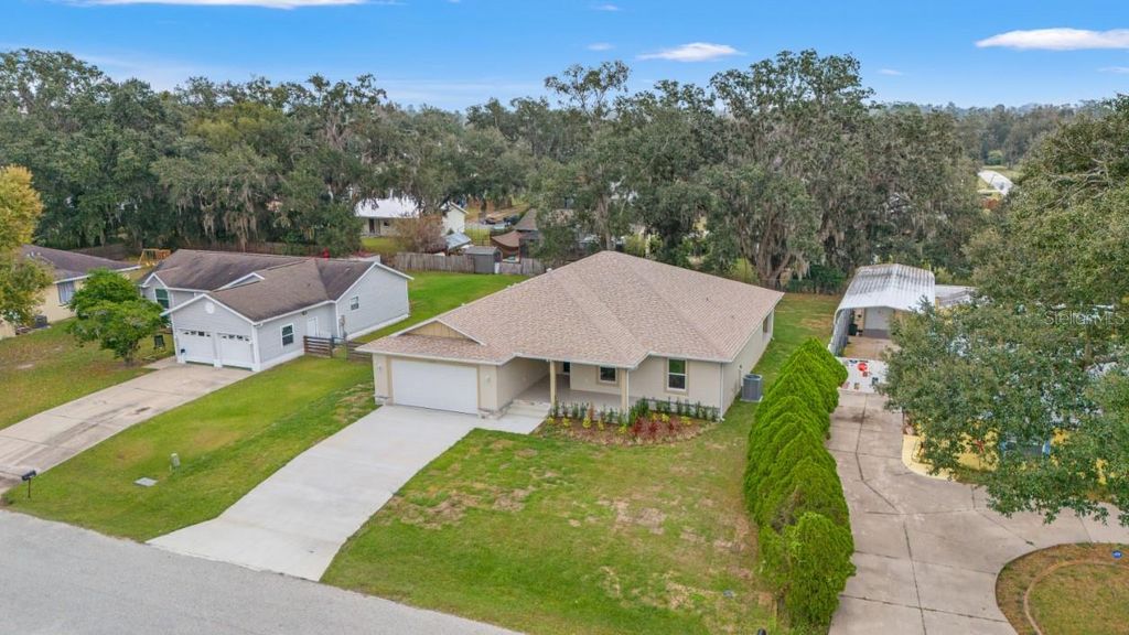 Photo of 12038 San Angela Drive, San Antonio, FL 33576 (MLS # TB8456243)