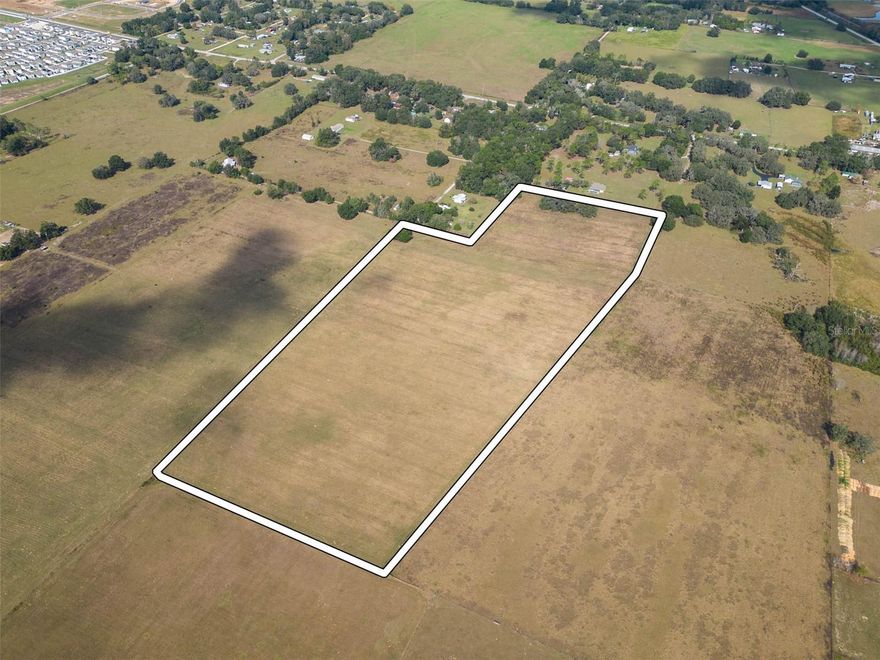 Tremendous opportunity to acquire a 26.06 land tract with great potential for future development and 1031 exchange investment. Sale consists of 2 parcels (Pasco parcel#'s 12-25-21-0000-00800-0000 and 12-25-21-0000-00900-0030) totaling 26.06 acres situated on the path of the proposed US98 reroute into Dade City. Proposed US98 project would create approximately 1,000 feet of road frontage along the new US98 route. Parcels have been annexed in to the Dade City limits. The Dade City planning department has conditionally approved the rezoning of the parcels for a planned unit development. A planned unit development plan has been submitted to Dade City planning with approval pending based on conditions. Conditional approval uses include single family residential and multi family with a maximum of 4 residential units per acre and lot widths ranging from 40' to 60'. City water and sewer utilities are nearby at other recently completed residential developments. Located 1.3 miles to newer shopping plaza that includes big box grocery store, restaurants, and banking. Only 5.2 miles to Lowe's, WalMart Supercenter and less than 30 minute drive to larger shopping malls.