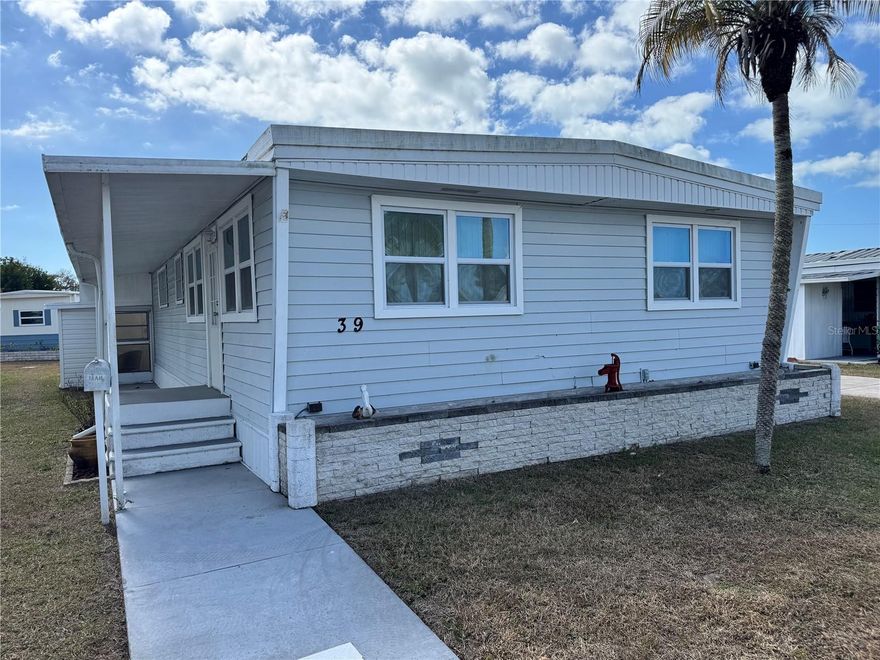Charming 2 bedroom, 2 bath furnished double wide mobile home located in a community that offers boat slips and a boat launch leading out to Lemon Bay and the Gulf.  Bridge clearance only allows for small boats. RESIDENT OWNED, desirable and welcoming 55+ MAINTENANCE-FREE community. Whether you're seeking a winter retreat, a year-round residence, or an easygoing vacation getaway, this home delivers an unbeatable lifestyle.   Spend your days cruising the Intracoastal, fishing, or exploring the tranquil beauty of nearby MANASOTA KEY and GULF BEACHES, all just minutes from your doorstep. The community offers an impressive list of amenities and activities designed for easy living and social enjoyment: a clubhouse, library, shuffleboard courts, bocce ball, and a HEATED POOL to relax with neighbors or unwind in the Florida sunshine. Lawn care is included and low HOA fees of $188 monthly. Enjoy the convenience of being just minutes to Manasota Key Beach. Only 13 minutes to Englewood Beach and it's popular restaurants, shops, and entertainment. Whether you're a seasonal visitor or looking to downsize into a year-round paradise, this home offers comfort, community, and coastal charm. Home offers a great room with newer wood laminate flooring.  Both bedrooms offer carpet.  Master has a king bed and guest room has twins. Kitchen has Stainless steel appliances. Side of home offers a separate entry into the kitchen/dining area.  Shed on site. Washer and dryer hook ups outside of unit but community has on site laundry facilities. Carport was destroyed in storm and quote has been attached.