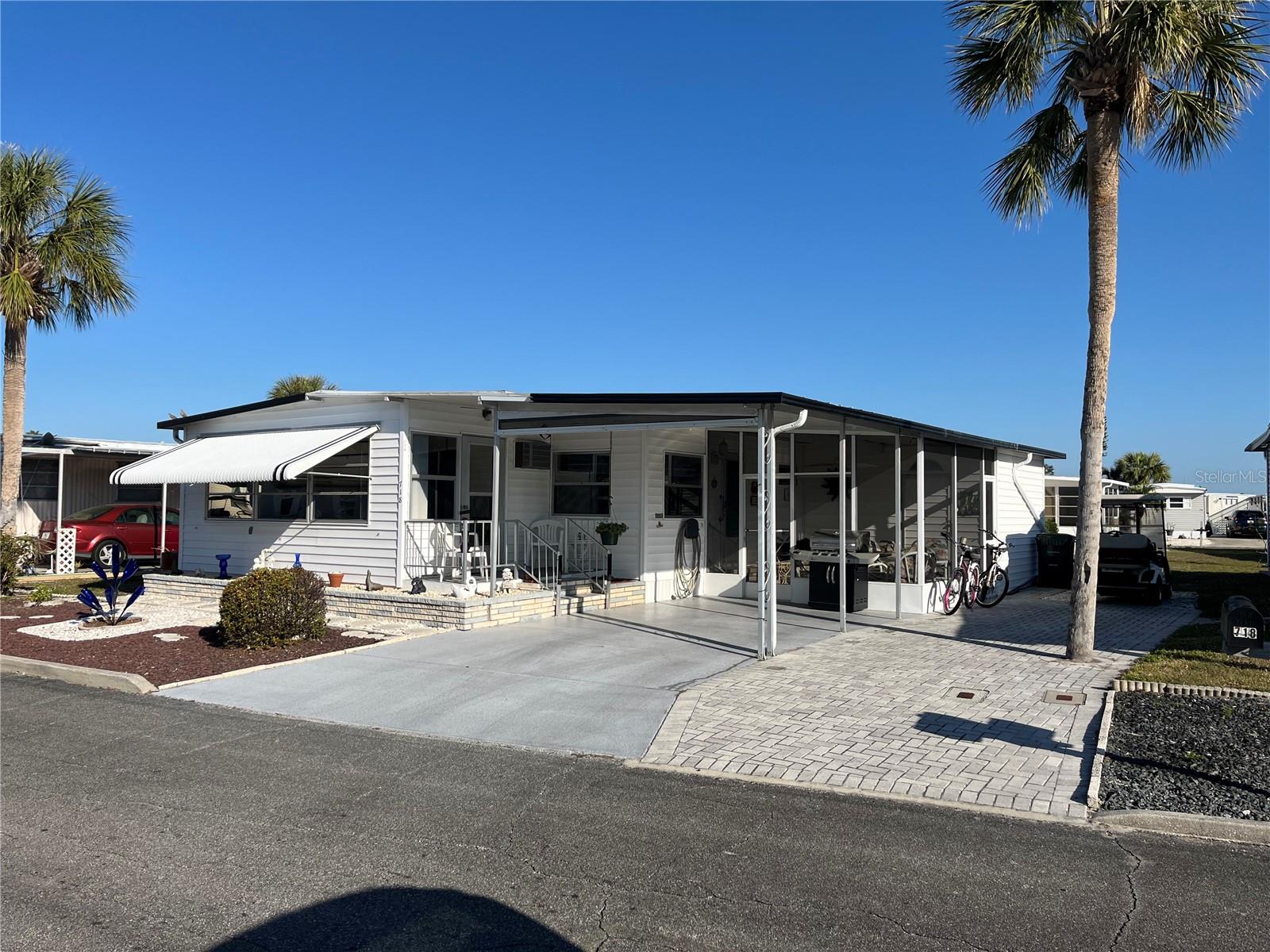This home has vinyl siding, the AC is 2 years young, the best of both worlds, a screen room on the drive side and a Florida room on the front. Updated tile Shower, Pergo laminate flooring too! Extra side pavers gives added side by side parking, open kitchen with pass through, DO not miss this one.
Venice Isle is the premier resident owned over 55 Mobile home Park in Venice. There are close to 1000 homes with the most active residents. There is always something going on for you to do. We have many Park gatherings and first rate shows on site. The Park has every amenity you can imagine. Come take a walk through both of our 2 clubhouses and make yourself at home. The Park has 2 tennis courts, a fitness center, 2 heated pools, 2 hot tubs, saunas, putting greens, shuffleboard, Bocce ball, miniature golf, art rooms, pool room, TV lounges, card rooms, library, horseshoes, ceramic kilns, 2 huge ballrooms, Sunday services and much more!