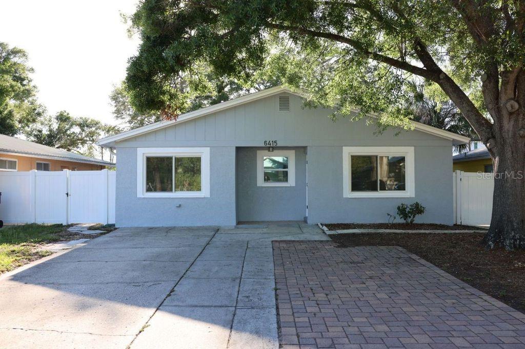 Updated South Tampa, well maintained 3 bedroom, 3 bath with an additional attached studio living area. This area can be made into an in-laws quarters or additional living space/bonus room that has a mini kitchen (no stove), full bathroom, own set of washer and dryer, separate exterior entrance, and separate gated side yard . Solar panels installed, resulting in lower electric bills. Upgraded hurricane windows and back sliding doors. The backyard provides an oversized screened in patio space, a shed that is ready for electric setup, and vinyl fencing with two gates. 2020-2021 entire house was renovated to include new roof, new drywall, new toilets, sinks, showers, vinyl waterproof flooring, new electrical, new LED lights, new kitchen cabinets, matching new granite countertops throughout, custom kitchen island, barn door walk-in pantry, new vinyl fence, new water heater, and new plumbing. There is also an additional washer and dryer on the screened in patio. Application fee of $75 per adult.