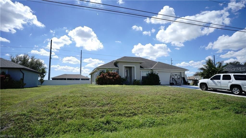 Photo of 110 NW 24th Terrace, Cape Coral, FL 33993 (MLS # O6360045)