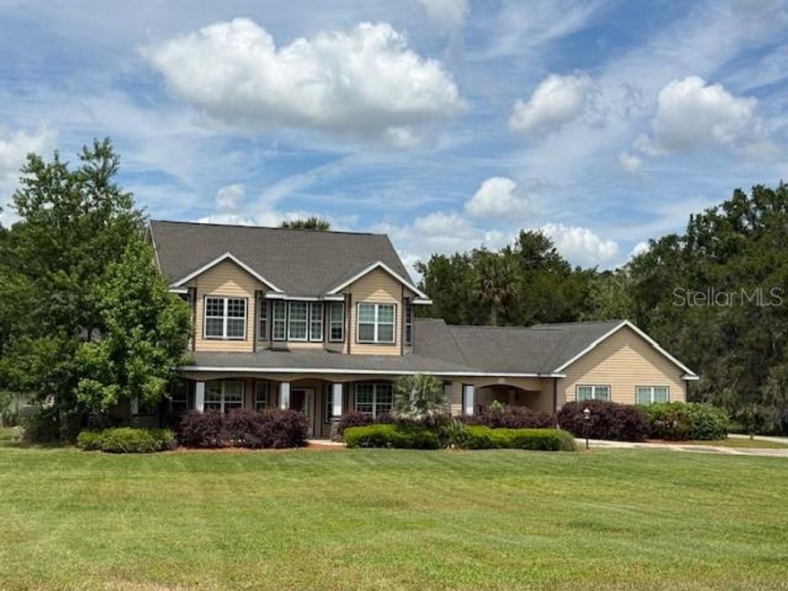 One or more photo(s) has been virtually staged. Welcome to this two-story pool home situated on an expansive 6-acre lot, offering the ideal blend of luxury and location. Nestled within a private gated community and surrounded by multi-million-dollar horse farms, this property is just 2 miles from the Florida Horse Park and bordered by the scenic Florida Greenway. Enjoy convenient access to nearby outdoor destinations, including Historic Santos Park, SW 49th Trailhead, and the Land Bridge Trailhead—ideal for riding, hiking, and exploring.

Positioned on a quiet cul-de-sac, this home offers privacy and endless potential to transform it into your dream residence. The primary bedroom suite is conveniently located on the first floor. The kitchen features a large walk-in pantry, dinette area, ceramic tile flooring, abundant cabinet storage, and granite countertops. The spacious living room boasts high ceilings, laminate flooring, a cozy fireplace, and direct access to the pool area—ideal for indoor-outdoor living. Upstairs, a generous family room provides additional space for entertaining or relaxing. All bedrooms include en-suite baths, and the office can easily be converted into a fifth bedroom. The pool area features a large screened lanai and a outdoor kitchen area to enjoy sunny Florida.

This property is being sold as-is, presenting a unique opportunity to customize and add value in a highly sought-after area.

Don’t miss your chance to own a rare piece of paradise in this prime location—schedule your private showing today. Homes with this much land, privacy, and potential do not last long!

The home is being sold in As Is condition. All buyers must view the home before submitting an offer.