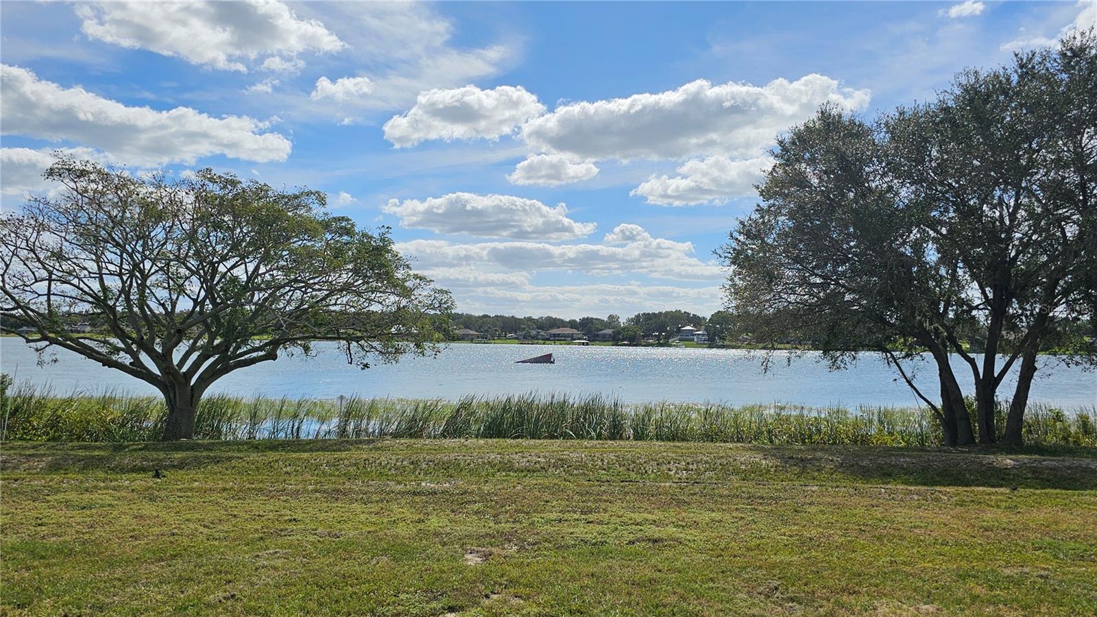 Beautiful Waterfront Lot! This amazing lakefront property is the perfect lot to build your dream home in upscale, gated Lake Juliana Estates! This lakefront lot features 100 feet of true waterfront on Lake Tennessee. The property has already been cleared to the shoreline. Gorgeous 108-acre public lake offers boating, water skiing, fishing, and more. Lake Juliana Estates is a gated community offering resort-style amenities including fitness center, tennis courts, pickleball, clubhouse and community boat ramp to Lake Juliana. This ideal location is close to I-4, just a short drive to Orlando or Tampa.