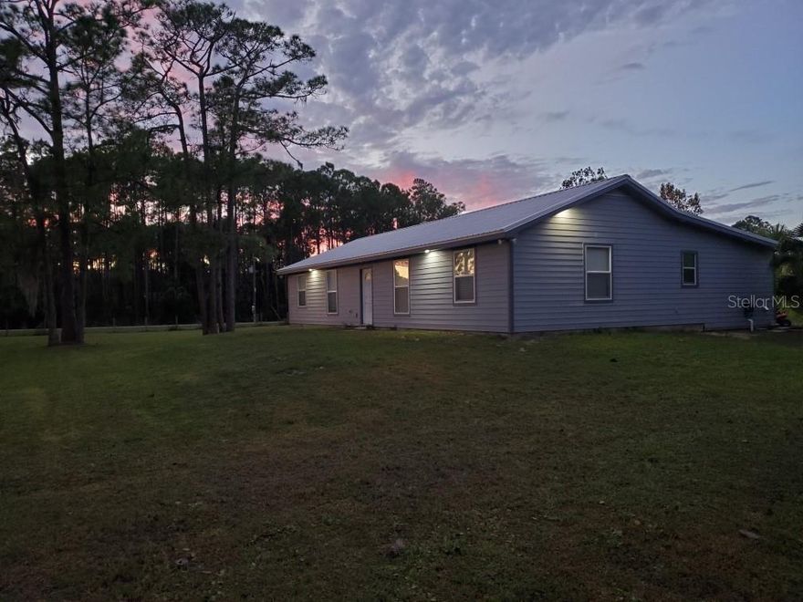 MAJOR REDUCTION!!!!!!!!! EXCELLENT LOCATION!!  Bikers, Race Fans, Campers-This is your ticket to live your dream! 4 bedroom, 2 full bath home with a 12 foot tall 60X40 foot Pole Barn for bike parking, camping and storage. This 2+ Acre property is only 1.6 miles from the New Smyrna Speedway, .6 miles from the famous Cabbage Patch-Daytona's oldest biker bar and 15 minutes from Daytona International Speedway. The metal roof was installed in 2019 as well as James Hardy siding and soffits. The property is completely fenced with 2 working gates for privacy. There is also a pond and private well. The pole barn could easily be enclosed making for a great work shop or barn. This beautiful natural setting  offers peaceful country living  with quick easy access to beaches, restaurants, the flea market and Daytona attractions. BRING OFFERS, MOTIVATED SELLER!!!!!!!!!!!!!!!!!!