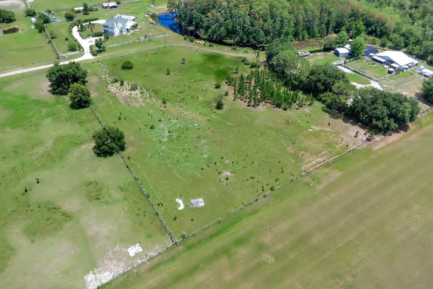 Unique is the word for this 4.68-acre lot offering the perfect location to build your custom dream home. The community offers its own runway for the aviator in the family! This amazing lot features over 300 feet of frontage on the community airstrip! The community is also zoned for horses! Wow, talk about an exciting place to live! This property is surrounded by similar sized residential lots and mostly cleared with electricity nearby. Enjoy being just minutes from the Boat Ramp with access to the Alligator Chain of Lakes. What an ideal location for the boating and fishing enthusiast! It doesn't get any better than this. Whether you're an aviator, equestrian, boatsman or love to fish, this property has your name on it!  Just a short drive to all of the major highways, Lake Nona, Orlando International Airport, Medical City, and Beaches. NO HOA!!! This location will provide you lots of space and privacy but within minutes you will be on E 192 and the fast growing area of South Narcoossee Road (Publix, McDonalds, Wawa, Walgreens, etc); a one hour drive will give you the opportunity to enjoy the beach area in Melbourne. WOW, Life is Good!!!