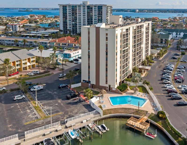 CLEARWATER BEACH ISLAND ESTATES CONDO W/ BREATHTAKING WATER VIEWS!!! One Year lease only!!! This tastefully FURNISHED one bedroom condo with amazing water views is ready and waiting for you! Nicely updated, very clean, ceramic tile through. The generously sized living/dining room combo is ideal for relaxing or entertaining. The bedroom has a large walk-in closet & plenty of natural light. Located in the desirable community of Island Estates, the Dolphin Cove complex offers a private community pool, outdoor grill area, and a fishing pier. You can walk, ride your bike or take the trolley to the beach! No need to worry about parking! Grocery stores, wonderful restaurants, bars, churches, banks are all nearby. Tenant is only responsible for electric, all other utilities are included! No pets, no smoking. $2500/mo seasonally