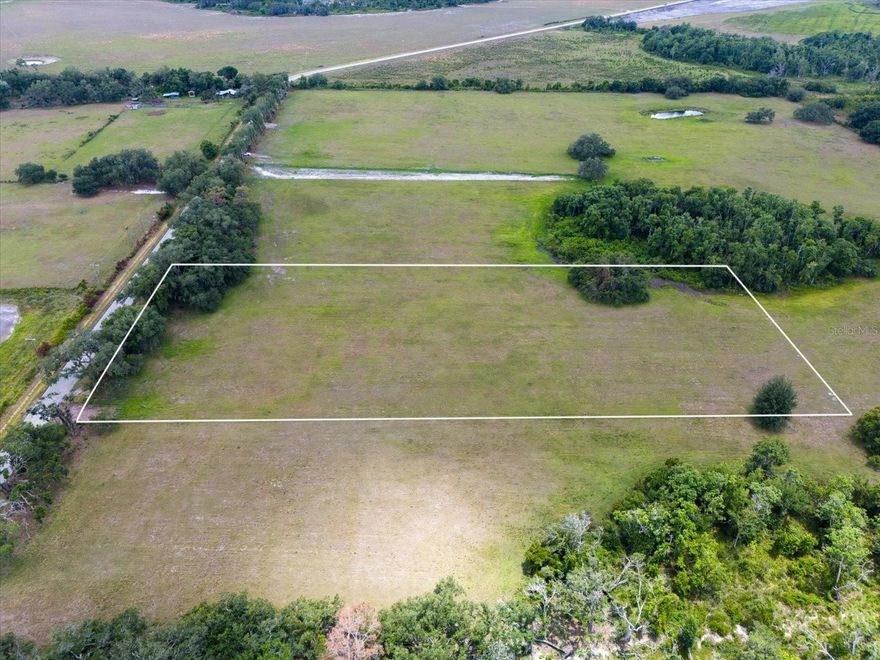 Lot 4-11800 MJ Rd. Your search for a buildable 5+ acre lot in a non-deed restricted area of beautiful Myakka City may have just ended! This 5.16 acre parcel presents an unmatched opportunity to design and build the custom home of your dreams. Located off the quiet, rural MJ Road this lot is already cross fenced and cleared and ready to host your brand new Florida homestead. The back area of the lot features a very small area of wetlands creating a private and tranquil buffer of trees and native shrubs. This lot truly is a blank canvas to bring your home construction dreams to fruition and the agricultural backdrop of Myakka represents the best of the “Old Florida” lifestyle. Myakka City is a quaint, rural area located within close driving proximity to Lakewood Ranch, Sarasota, Bradenton and all of the renowned barrier islands with beautiful sand beaches, such as Manasota, Siesta, & Longboat Key and Anna Maria Island. You will be able to enjoy the slower pace & peace of country life, but still have all the amenities such as shopping, entertainment & dining within a short approx. 25 minute drive. This lot is nearby the TerraNova Equestrian Center & Estates, Miakka Golf Club and also the under-construction Soleta Golf Club, proving this is a desirable area that continues to grow and thrive and will be a worthwhile investment far into the future. Also, Myakka State Park is very near and features many shaded trails for hiking, biking, & horseback riding in addition to lakes and rivers for paddling & fishing adventures. There are additional adjacent lots available for purchase, for those looking to have a best friend or family member be your next door neighbor, so please don’t hesitate to come view this lovely parcel very soon. You will not want to miss it! 11800 MJ Rd.