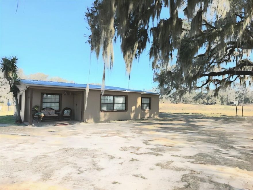 M-2 Industrial Zoning Marion County! 735' of frontage on NW Gainesville Road, and located just south of SR 326. CBS employee residence with metal roof. A wet weather pond is on the property that is in the flood plain. (Area within flood plain = 1.34 acres; Outside flood plain = 3.08) Drive by the property to show. Building shown by appointment.