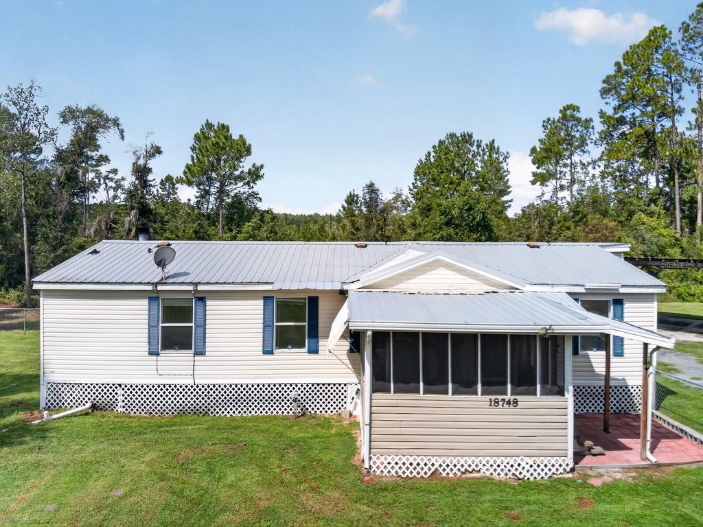 Photo of 18748 NE 148th Terrace Road, Fort Mccoy, FL 32134 (MLS # OM732608)