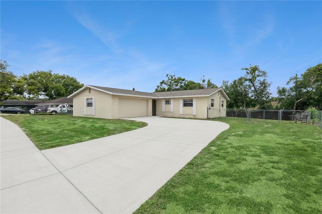 Photo of 1912 Saxon Boulevard, Deltona, FL 32725 (MLS # O6431926)