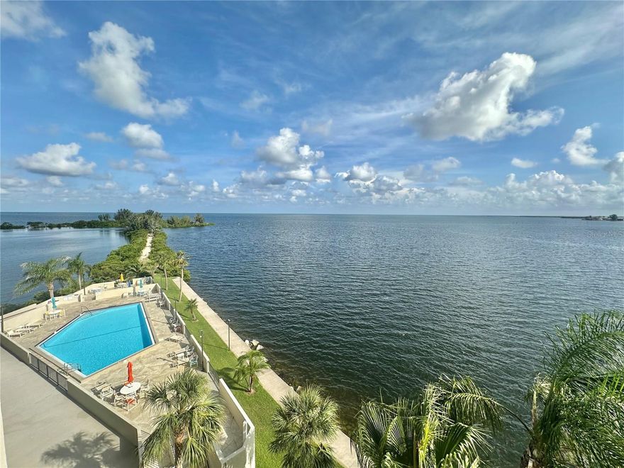 "JAW DROPPING GULF OF AMERICA VIEWS, from this fifth floor furnished condo. Relax on the 22 ft private balcony with your favorite morning or evening beverage or meal watching the sparkling reflections of the Gulf and enjoying it's soothing breezes. Watch  the dolphins play, the manatee float by, and all that Mother Nature has to offer on this "little island paradise. This 2 bedroom 2 bath condo features additional bonus room area with pull out sofa that can be used as dining room, office, den or maybe additional guests sleeping area. Upgraded Kitchen features newer self close cabinetry and granite counter tops. Dining has large glass top table with 8 chairs. Condo is offered furnished with all the appliances including washer and dryer. Two 8 foot wide sliding glass doors offer beautiful water views from the living room.dining area,kitchen,and master suite. This quiet island community is surroundd by water and boasts Gulf front heated swimming pool , tennis & pickleball courts, private beach, picnic area, nature's trail and 24 hour guards for your upmost security. This is all located in quaint & quiet Hudson Beach close to multiple area parks, SunWest Aqua Park,beaches, golf courses, and restaurants. Easy commute to all that the Tampa Bay and St Pete/Clearwater areas have to offer both day and night. This condo is offered rent for a month or more and rate may vary depending on the time of year and length of stay. . Call today!
