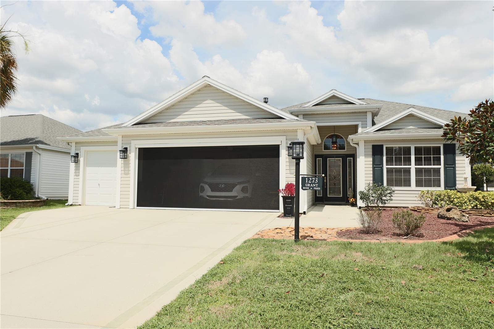 Talk about pride of ownership! Own your own little piece of paradise in this beautiful Villages Sumter community that is just a few blocks from shopping, restaurants, golfing, and all of the wonderful amenities this community has. Kitchen was beautifully designed with an eat-in nook, granite counters, upgraded cabinetry, and center island. Home has luxurious pet friendly engineered hardwood floors that seamlessly flows throughout the entire home. Enjoy holiday meals, dinner parties and more in the oversized formal dining room. Enjoy the spacious living room that features vaulted ceilings and a ton of natural lighting. Separate den/office is a perfect flex area for your preferred use. Relax in your private master suite with 2 walk in closets and an on-suite master bath that features a dual vanity and an oversized walk-in shower with a built in bench seat. This home also offers the convenience of an in-door laundry room with a utility closet. If you enjoy relaxing outdoors, you'll love the 10 x 31 screened-in birdcage patio. Perfect for entertaining or to bar-b-que, or to sit out with your morning coffee. There is room for your golf cart in the 3 car garage with an automatic roll up screen door on the 2 car side garage door.