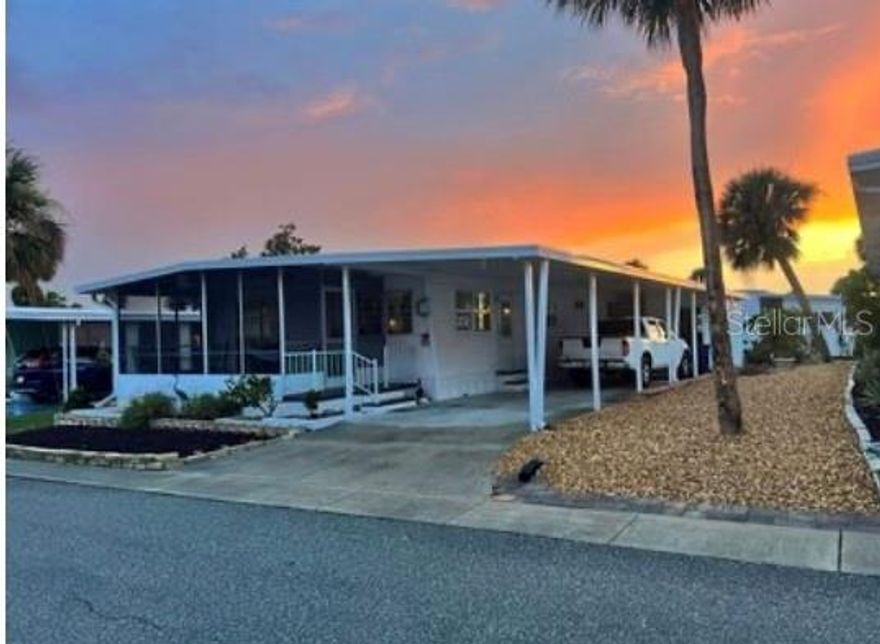 Well maintained 2 bedroom, 2 bathroom doublewide unit! This home has laminate flooring throughout with tile in the bathrooms. The kitchen is spacious with plenty of cabinetry and storage. It is open to the dining room with a breakfast bar. The living room and dining room are open and a great space for entertaining. One of the best features of the home is the screened room at the front of the house. It's the perfect spot to enjoy the beautiful Florida weather! Other features include an indoor washer/driver, new windows, and a beautiful open patio in the back yard. Also, the entire home has been replumbed! This home is located in Japanese Gardens, an active 55+ community close to both Downtown Venice and Downtown Englewood and approximated 2 miles to Manasota Beach!