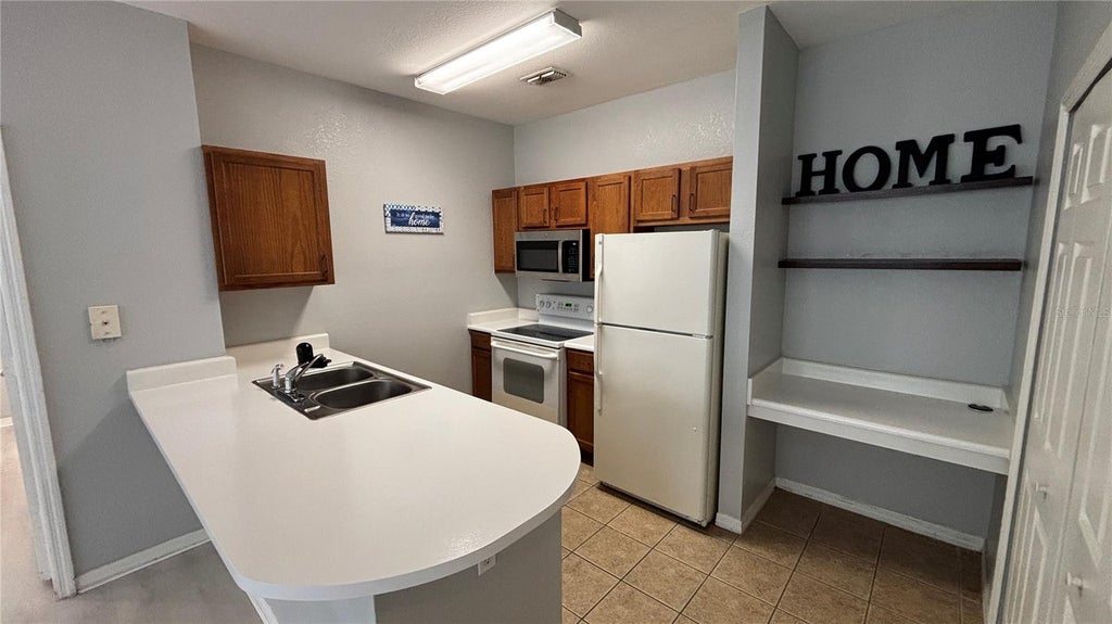 Photo of 8103 Lillies Way #108, Orlando, FL 32825 (MLS # O6427142)