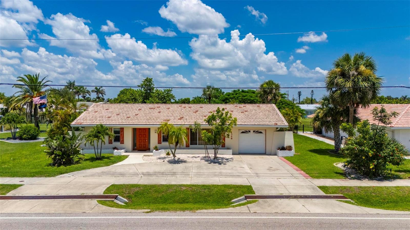 Welcome to this beautifully furnished 2-bedroom, 2-bathroom home located in the heart of Punta Gorda. This spacious and well-maintained residence offers a blend of comfort, functionality, and Florida charm—perfect for full-time living or a seasonal retreat. Inside, you’ll find a bright and open layout featuring a large living room and dining area that flows into an enclosed Florida room—ideal for lounging, entertaining, or enjoying your morning coffee.
The kitchen is generously sized, offering abundant cabinetry, a built-in pantry, and ample counter space for meal preparation. Both bedrooms are oversized with large closets, providing plenty of storage. Each bathroom is spacious and thoughtfully designed, complete with windows for natural light, plenty of cabinetry, and convenient layouts.
The rear lanai wraps around to the side of the home near the primary suite, creating a serene outdoor living space that’s perfect for relaxing or dining alfresco. Additional features include a durable tile roof, newer windows, a complete HVAC system installed in 2018, and a beautifully landscaped yard. The circular driveway offers great curb appeal and easy access, while a rear outdoor patio—accessible through the garage—adds another great space for gatherings or enjoying the Florida sunshine.
Offered furnished, this home is truly move-in ready. Located just minutes from elite golf courses, fine dining, shopping, entertainment, fishing piers, and the breathtaking blue waters of Florida’s Gulf Coast beaches—this is Florida living at its finest.