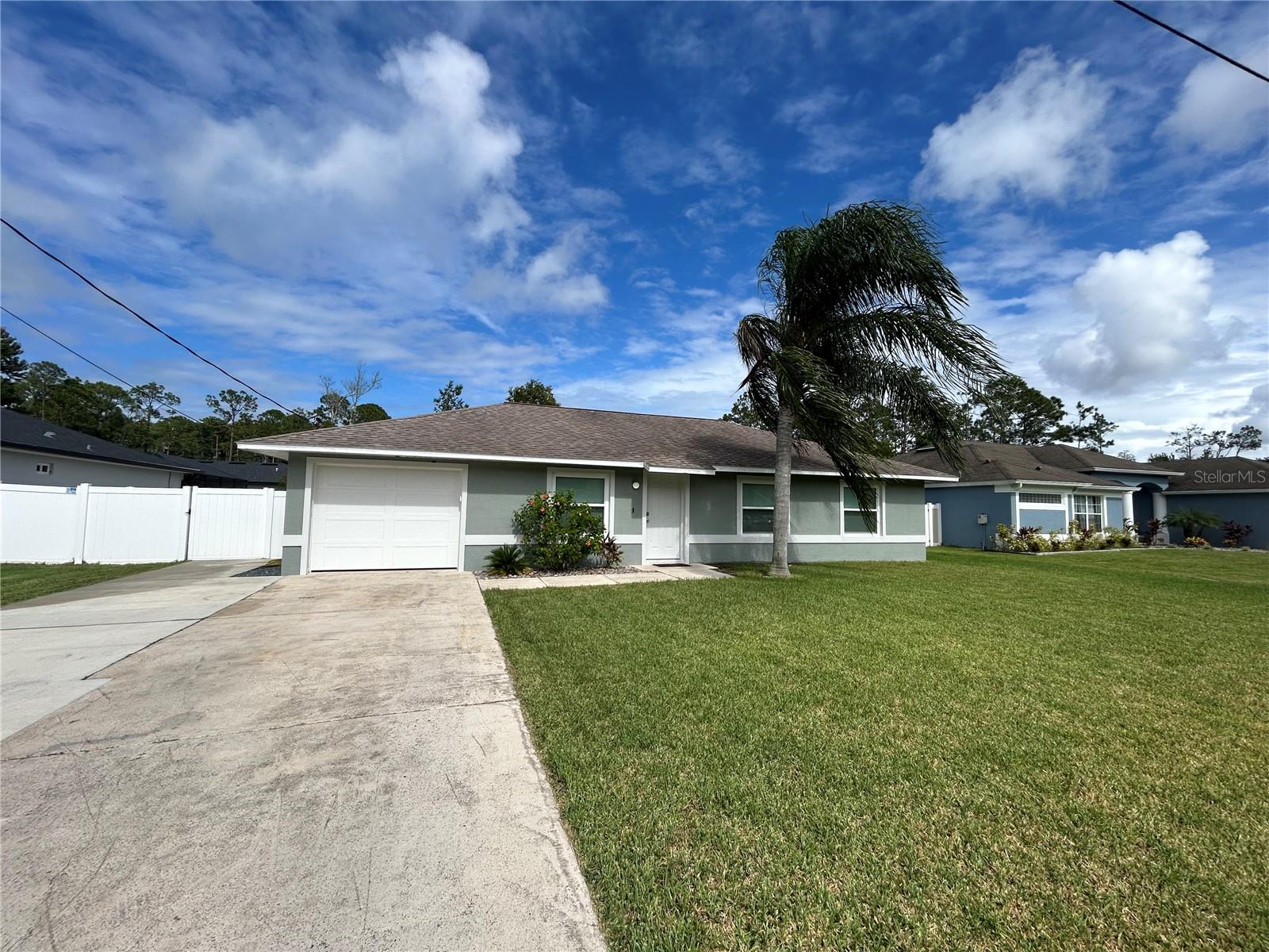 MOVE IN READY! Fully renovated 1,150sq’ 3 bedroom 2 bath block home on a cul-de-sac located in the Z section Palm Coast, FL. Everything inside home is updated, from brand new kitchen appliances, garage door, new windows, custom closets, ceiling fans, light fixtures, plugs, switches, doors, and more. Huge covered screen porch 30’x13’ perfect hangout for the Florida nights which has access from primary bedroom and main living area. Great size backyard with landscaping around the whole house. Shed in the backyard for the outside tools and a wider driveway for extra car space. Outside of the home is freshly painted and white vinyl fence with gates on each side of the home for privacy.