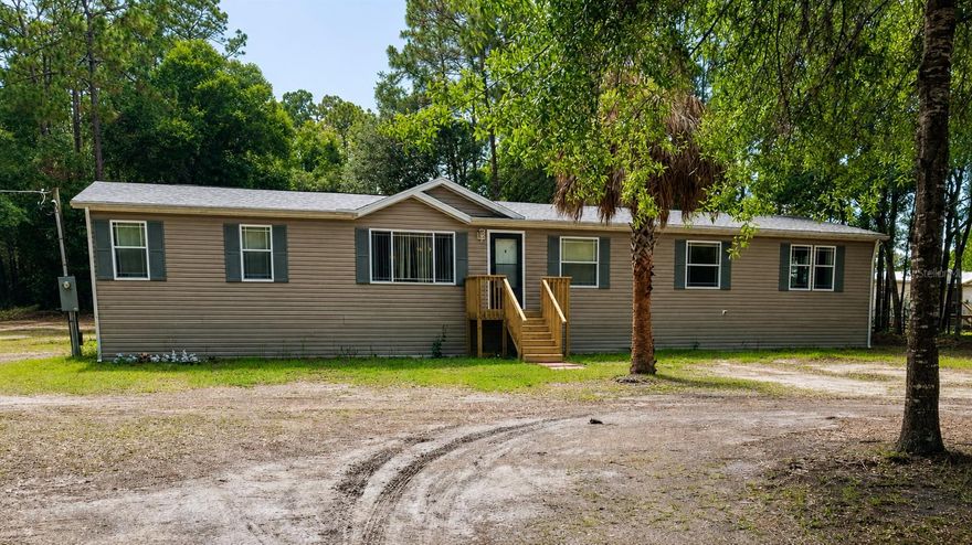 Tucked away on 2.13 private acres in the heart of Homosassa, this stunning 4-bedroom, 2-bath home offers the perfect blend of space, comfort, and tranquility. Set far back from the road and framed by a beautiful line of mature trees, the property creates a secluded sanctuary feel from the moment you arrive.

Inside, you’ll find 2,356 square feet of thoughtfully designed living space featuring an oversized kitchen with abundant cabinetry and counter space, ideal for entertaining, large gatherings, or everyday living. In addition to the four spacious bedrooms, the home also features a large private den complete with a cozy fireplace, making it the perfect flex space for a home office, media room, or quiet retreat.

The expansive primary suite offers a relaxing escape with a spacious bathroom featuring a shower, dual vanity, and a walk in closet. A large laundry room provides added convenience and functionality.

Recent updates include a 2023 roof and 2020 HVAC system, offering peace of mind for years to come. Brand-new wood staircases enhance all three entryways, adding warmth and charm to the exterior. 

Step outside to enjoy the covered wood deck overlooking the peaceful backyard, perfect for morning coffee, evening sunsets, or enjoying the natural surroundings. The property also features a storage shed with power already in place, offering versatile space for storage, workshop projects, hobbies, tools, equipment, or recreational gear.

If you’ve been searching for privacy, acreage, and a move-in ready home with character and space to breathe, this Homosassa retreat delivers it all.