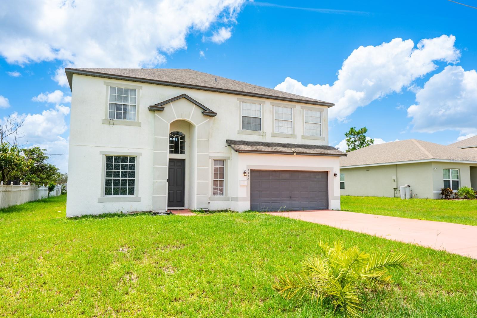 One or more photo(s) has been virtually staged. Seller may consider buyer concessions if made in an offer ~ This spacious, 4-bedroom, 3-full and 1-half bath home in the heart of Poinciana Villages offers room to grow—inside and out! With a BRAND NEW WATER HEATER (2025), SOLAR SYSTEM (2024, assumable), NEW UPSTAIRS A/C (2023), and NEW ROOF (2022), it’s ready for you to move in and make it your own – made for everyday living with long-term comfort in mind. The interior of the home delivers a flexible layout ideal for multi-generational living or families that need extra space. The OPEN CONCEPT kitchen and family room flow seamlessly out to a large SCREENED LANAI – perfect for casual gatherings with friends or quiet evenings with family. Upstairs, a rare OPEN AIR DECK looks out over the expansive .27 ACRE LOT, providing a peaceful view and even more usable space. Every inch of the interior has been thoughtfully designed and recently refreshed, from the 2023 VINYL PLANK WOOD FLOORING throughout the main living areas to the plush carpet in the bedrooms. The staircase is new in 2024, the formal dining and living room freshly painted, and both the kitchen and bathrooms have been updated with a clean, modern feel. Large windows bring in plenty of NATURAL LIGHT, and MULTIPLE LIVING & FLEX SPACES – including formal, casual, and two oversized bonus rooms—make it easy to tailor the home to your lifestyle. Ideally situated in a growing area, this home feels peaceful and private while still being part of an established, friendly community. Poinciana Villages offers residents a LOW HOA and a wide range of AMENITIES; including cable and internet, community events, a recreation center, community pool, and fitness center. Conveniently close to parks, sports fields, medical facilities, and major roadways like US 17, I-4, and Florida’s Turnpike. You are also just a short drive to major destinations like Orlando’s theme parks, area attractions, Celebration, Champions Gate, Hunter’s Creek and more! Updated where it counts, with space and flexibility to match – this home is a smart choice for anyone looking to spread out and settle in. Call today to schedule a tour!