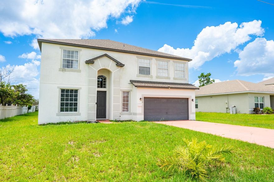 One or more photo(s) has been virtually staged. Seller may consider buyer concessions if made in an offer ~ This spacious, 4-bedroom, 3-full and 1-half bath home in the heart of Poinciana Villages offers room to grow—inside and out! With a BRAND NEW WATER HEATER (2025), SOLAR SYSTEM (2024, assumable), NEW UPSTAIRS A/C (2023), and NEW ROOF (2022), it’s ready for you to move in and make it your own – made for everyday living with long-term comfort in mind. The interior of the home delivers a flexible layout ideal for multi-generational living or families that need extra space. The OPEN CONCEPT kitchen and family room flow seamlessly out to a large SCREENED LANAI – perfect for casual gatherings with friends or quiet evenings with family. Upstairs, a rare OPEN AIR DECK looks out over the expansive .27 ACRE LOT, providing a peaceful view and even more usable space. Every inch of the interior has been thoughtfully designed and recently refreshed, from the 2023 VINYL PLANK WOOD FLOORING throughout the main living areas to the plush carpet in the bedrooms. The staircase is new in 2024, the formal dining and living room freshly painted, and both the kitchen and bathrooms have been updated with a clean, modern feel. Large windows bring in plenty of NATURAL LIGHT, and MULTIPLE LIVING & FLEX SPACES – including formal, casual, and two oversized bonus rooms—make it easy to tailor the home to your lifestyle. Ideally situated in a growing area, this home feels peaceful and private while still being part of an established, friendly community. Poinciana Villages offers residents a LOW HOA and a wide range of AMENITIES; including cable and internet, community events, a recreation center, community pool, and fitness center. Conveniently close to parks, sports fields, medical facilities, and major roadways like US 17, I-4, and Florida’s Turnpike. You are also just a short drive to major destinations like Orlando’s theme parks, area attractions, Celebration, Champions Gate, Hunter’s Creek and more! Updated where it counts, with space and flexibility to match – this home is a smart choice for anyone looking to spread out and settle in. Call today to schedule a tour!