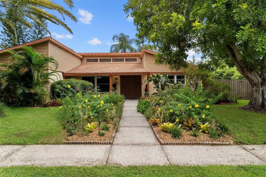 One or more photo(s) has been virtually staged. SAFETY HARBOR GEM in a wonderful location in HIGHLY-RATED SCHOOL DISTRICT – and in CENTRALLY LOCATED IN TAMPA BAY!   Great location -- 2 mins. from waterfront-lined Philippe Park with public boat launch, trails, historic sites and more! And -  5 mins. from lovely Safety Harbor (see more detail below)! Beautifully maintained POOL HOME w/HEATED SPA on a spacious CORNER LOT in highly sought-after neighborhood of Harbor Woods – 3 BR / 2 BA / 2-CAR GAR. Oversized yard, OUTDOOR BAR area, and HUGE COVERED LANAI create the ultimate outdoor oasis for entertaining and relaxing.  Add an outdoor TV in the bar area to watch sports or a show while dipping/floating in the pool – the perfect Florida lifestyle!  Inside, you’ll find ENGINEERED MAPLE WOOD FLOORS (2018), a cozy WOOD-BURNING FIREPLACE, and an updated MASTER SUITE with sliders opening to the pool and backyard. Kitchen features QUARTZ COUNTERTOPS, snack bar seating, and NEWER APPLIANCES (2019). Indoor laundry includes WASHER & DRYER (2024).  Step out back to your own PRIVATE RETREAT – SALTWATER POOL resurfaced in 2024 with propane-heated SPA, rescreened pool cage and recently painted pool cage frame (2025). BRAND-NEW ELECTRICAL PANEL (2025), roof (2014), A/C (2016), epoxy-finished garage floor (2025), new bedroom closet doors (2025), newer windows + hurricane shutters (plus brand-new 3rd bedroom window 2025) = peace of mind!  Harbor Woods is a peaceful, tree-lined neighborhood just minutes from vibrant Downtown Safety Harbor. Explore charming boutiques, restaurants, and lively community events like the Third Friday festivals and the Seafood Festival. Spend your weekends at Philippe Park, a 122-acre waterfront retreat with trails, playgrounds, picnic areas, and breathtaking views of Tampa Bay. Or unwind with a stroll along the Safety Harbor Marina and Waterfront Park before catching a sunset at the pier.  And - if you love live music, this town is for you – live music at multiple locations on Main Street almost every day of the week! Safety Harbor is not just a town, it’s truly a COMMUNITY.  This is more than a home – it’s a MOVE-IN READY FLORIDA LIFESTYLE in a prime location. Schedule your private showing today!
