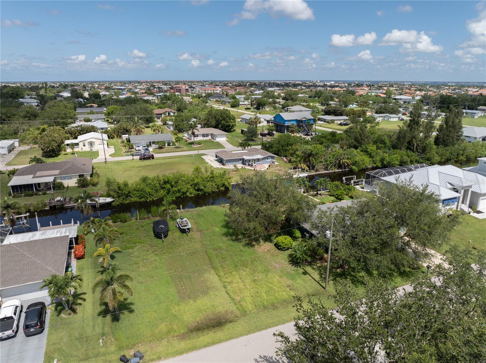 Build Your Dream Florida Lifestyle - Gulf Access Lot in Charming Punta Gorda! Discover the perfect Opportunity to create your ideal home in one of Florida's most desirable waterfront communities. This vacant Gulf- access lot comes with a Seawall already in place, giving you added peace of mind and saving you significant expense during construction. Enjoy Year- Round Boating, Fishing, and Breathtaking Sunsets right from your own backyard. Located in the Heart of Punta Gorda, this homesite offers the perfect balance of Serenity & Convenience. You're just minutes from Punta Gorda Airport, and close to the vibrant downtown scene filled with boutique shops, waterfront restaurants, and lively entertainment. Just a short stroll or bike ride away, Fisherman's Village awaits with Sunset Cruises, Local Art, and Tropical Dining. Whether you are retiring, building a vacation getaway, or relocating to Paradise, this lot offers an unbeatable lifestyle- no snow, no worries- just Sunshine and Salt Air!