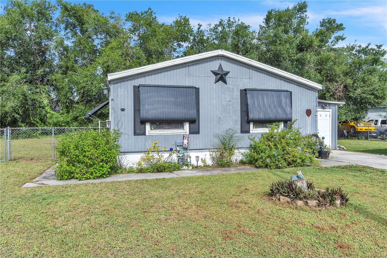 Opportunity knocks in Saint Cloud! This spacious double-wide manufactured home sits on owned land in a quiet, established community with no HOA and no lot rent. Featuring 2 bedrooms, 2 full baths, and a versatile bonus Florida room, the layout offers great potential for customization.
With over 1,000 sq ft of interior space, this home is ready for a creative vision. Whether you're an investor, first-time buyer, or someone looking to renovate and live in, there's plenty of upside here. The fenced-in yard provides privacy and room to expand, garden, or relax. A covered carport and paved driveway offer off-street parking and practical convenience.
Located minutes from Downtown Saint Cloud, East Lake Tohopekaliga, parks, schools, and shopping, this home offers small-town charm with easy access to the Turnpike, Kissimmee, and Orlando.
