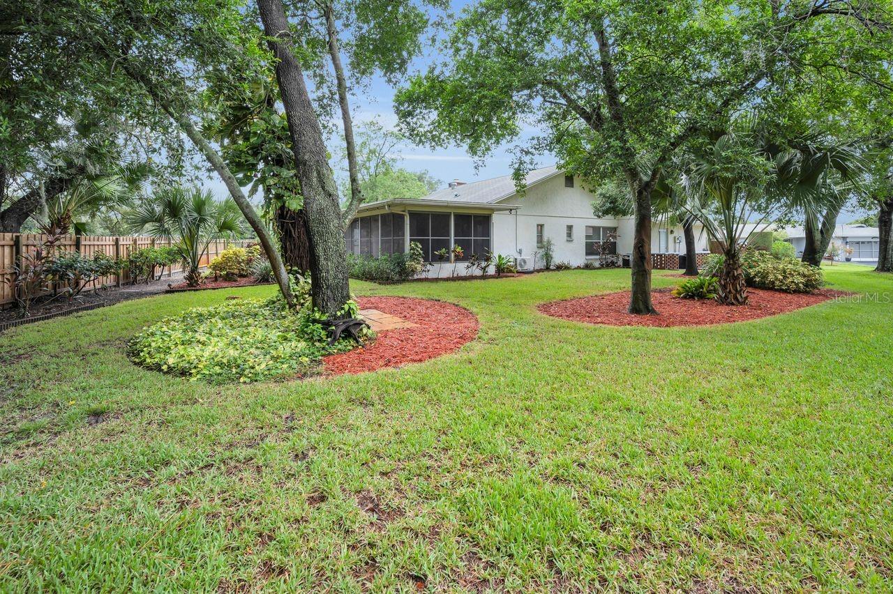 Welcome to this charming single-family home tucked away in the quiet 55+ community of Port Richey. This property features a spacious layout with 2 bedrooms, 2 bathrooms, and an attached garage. The open living and dining areas flow seamlessly, making it easy to entertain or simply relax at home. A bright kitchen offers plenty of cabinet space and a comfortable spot for casual dining. Step outside to enjoy an air conditioned Florida Room overlooking the backyard—perfect for morning coffee or evening gatherings. Conveniently located near shops, restaurants, schools, and just a short drive to the Gulf beaches, this home provides both comfort and accessibility.
