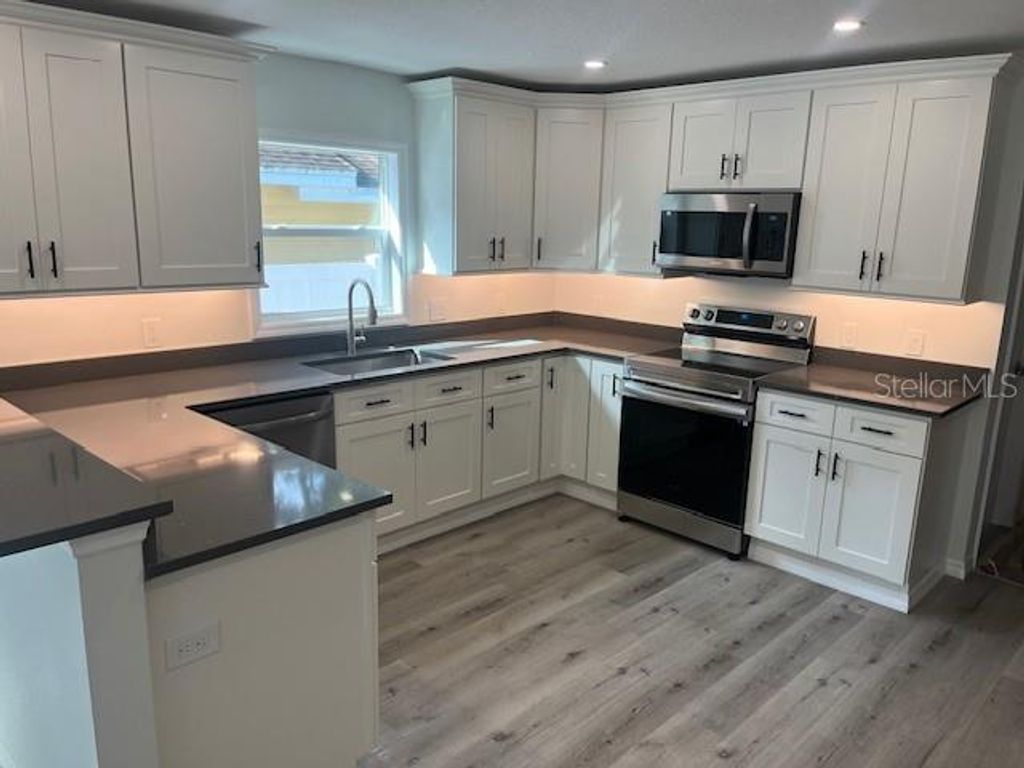 Photo of 1574 Ewing Avenue, Clearwater, FL 33756 (MLS # TB8423247)